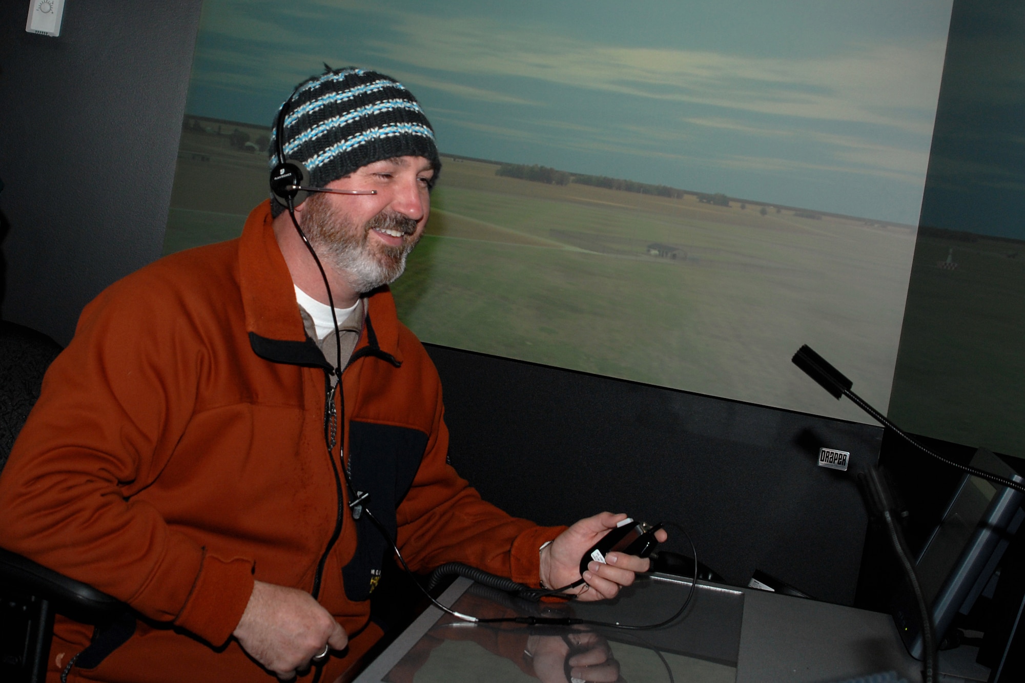 GRISSOM AIR RESERVE BASE, Ind. -- Ray Bailey, 434th Mission Support Group geospatial information manager, takes his turn controlling air traffic in an air traffic control simulator here March 15. Mr. Bailey and other guests were at a radar approach control facility here for a groundbreaking for a new ATC tower. When complete, the nine-story tower will provide Grissom's ATC with increased visibility, training simulator area, increased security, office space and enhanced environmental controls.  (U.S. Air Force photo/Senior Airman Damon Kasberg)
