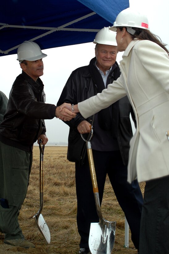 GRISSOM AIR RESERVE BASE, Ind. -- Col. William T. "Tim" Cahoon shakes the hand of and Jessica Mullins, a contracting company project manager, as Tom Weatherwax watches on after the three participated in a groundbreaking ceremony for Grissom?s new air traffic control tower here March 15. The new ATC tower, with a programmed cost of $7.4 million, will replace an existing structure built in 1965. When complete, the nine-story tower will provide Grissom's ATC with increased visibility, training simulator area, increased security, office space and enhanced environmental controls. Colonel Cahoon is the 434th Air Refueling Wing commander, and Tom Weatherwax is the Grissom Community Council vice president. (U.S. Air Force photo/Senior Airman Damon Kasberg)
