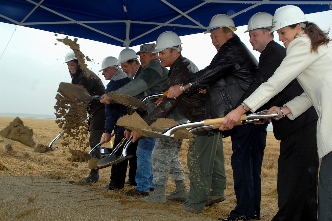 GRISSOM AIR RESERVE BASE, Ind. -- Shoveling the first dirt of a $7.4 million project, honored guests take part in a special groundbreaking ceremony for a new air traffic control tower here March 15. When complete, the nine-story tower will provide Grissom's ATC with increased visibility, training simulator area, increased security, office space and enhanced environmental controls. From left are Meredith Perks, case manager for Congressman Joe Donnelly; John Gilpin, 434th Air Refueling Wing honorary wing commander; Terry Albaugh, 434th Operations Support Squadron air traffic manager; Col. Nicholas Desport, Air Force Reserve Command A7 deputy director of installations; Col. William T. "Tim" Cahoon, 434th ARW commander, Tom Weatherwax, Grissom Community Council vice president; Marques Pflum, staffer for Senator Dan Coats; and Jessica Mullins, contracting company project manager. (U.S. Air Force photo/Senior Airman Damon Kasberg)