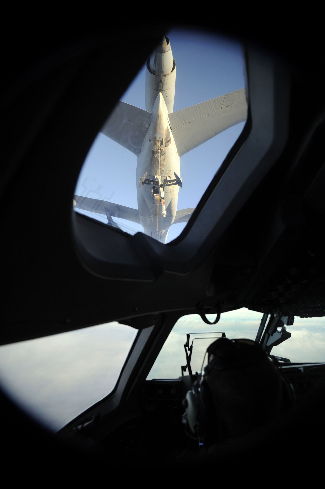 TRAVIS AIR FORCE BASE, Calif. -- An U.S. Air Force KC-10 Extender from the 349th Air Mobility Wing performs an aerial refueling of an U.S. Air Force C-17 Globemaster III while it is en route to Japan with a Search and Rescue team during an emergency response on March 12, 2011. (U.S. Air Force photo by Technical Sgt. Daniel St. Pierre/Released) 