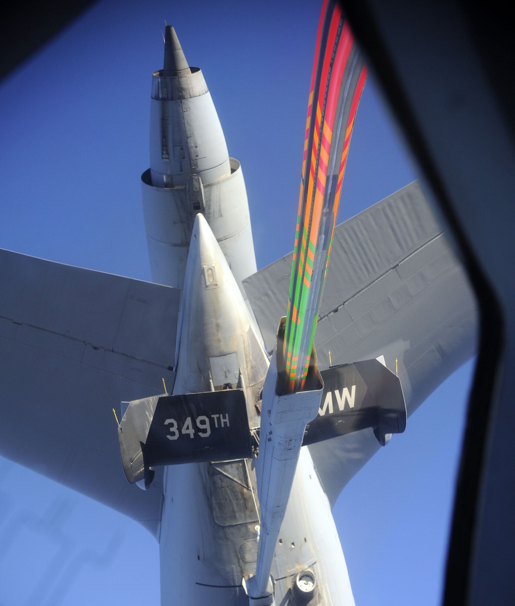 TRAVIS AIR FORCE BASE, Calif. -- An U.S. Air Force KC-10 Extender from the 349th Air Mobility Wing performs an aerial refueling of an U.S. Air Force C-17 Globemaster III while it is en route to Japan with a Search and Rescue team during an emergency response on March 12, 2011. (U.S. Air Force photo by Technical Sgt. Daniel St. Pierre/Released) 