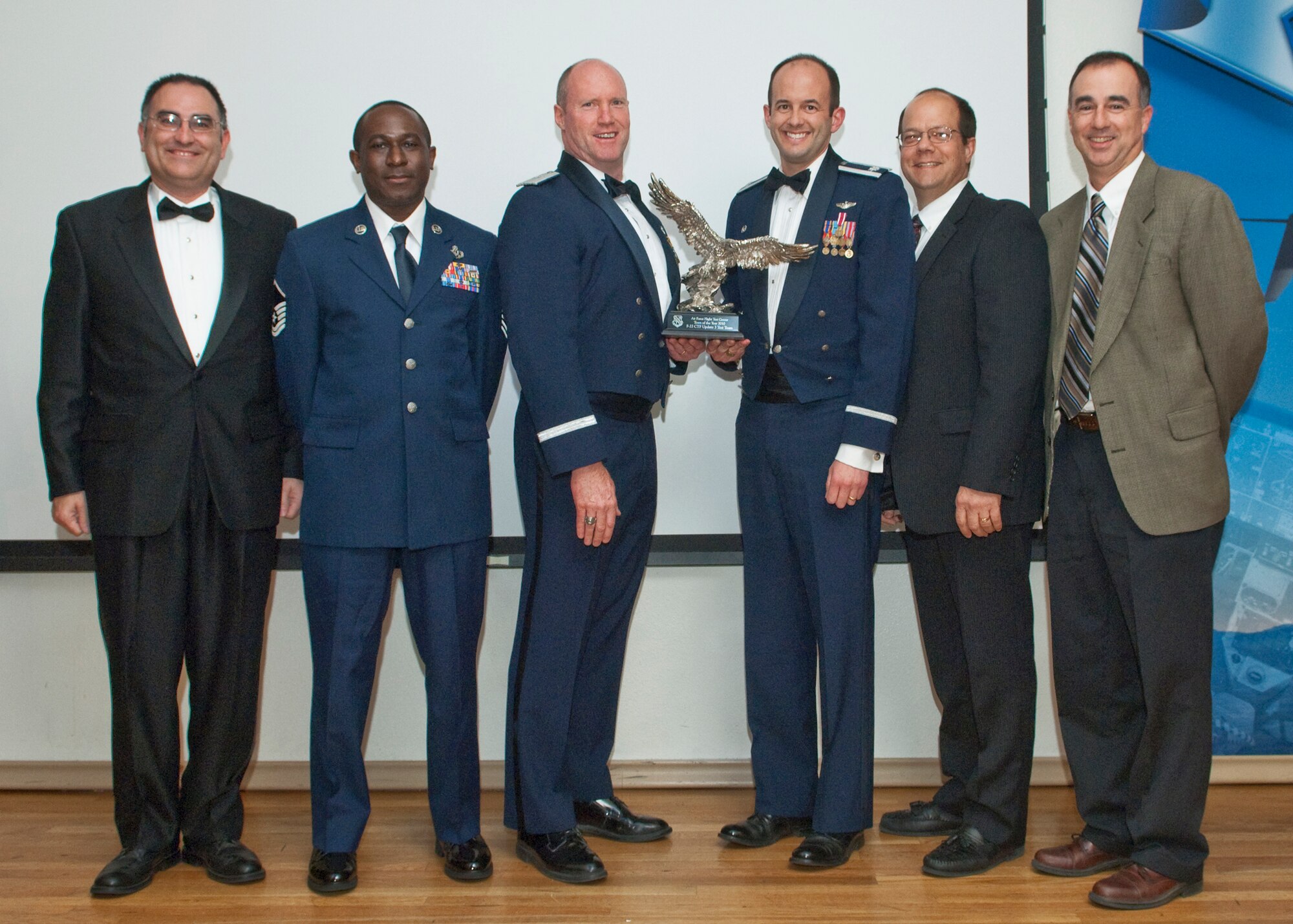 AFFTC Team of the Year-F-22 CTF Update 3 Test Team, 412th Test Wing From left to right: Bruce J. Wilder, 411th Flight Test Squadron,  Master Sgt. Kenneth Wilkerson, 412th AMXS/MXAR, Brig. Gen. Robert Nolan, AFFTC commander, Lt. Col. Ernest J. Teichert, 411th FLTS commander, Tony Rubino, 412th Operations Group, Charles Staley, 411th FLTS. (Air Force photo by Michael Yncera)