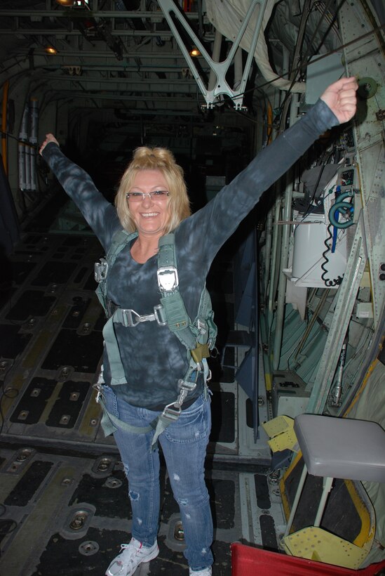 PATRICK AIR FORCE BASE, Fla. - A wife of a 920th Rescue Wing Reservist here shows her excitement on board an HC-130P/N King airplane before taking off. Col. Robert Dunn, 920th RQW Commander, invited spouses of the Air Force Reservists here to participate in special flights on HH-60G Pave Hawk helicopters and the King airplanes. This event allowed the husbands and wives of hard-working Reservists a glimpse into their drill training weekends and the aircraft they work to maintain. (U.S. Air Force photo/Capt. Ryan Liss)
