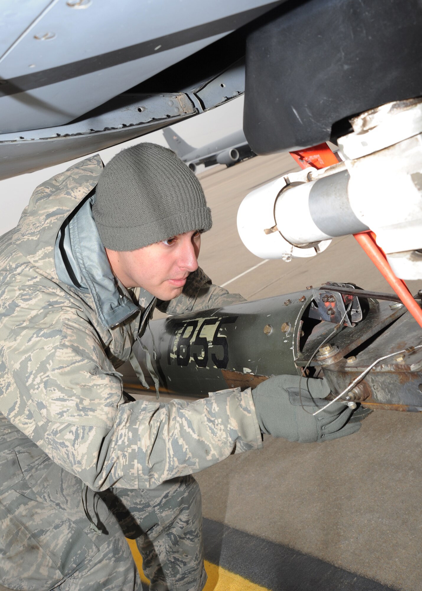 Airman 1st Class Connor Rankin, 22nd Maintenance Squadron crew chief, connects a tow truck to a KC-135 Stratotanker during a readiness exercise, March 9, 2011, McConnell Air Force Base, Kan. The NORE showcased the base capability to prepare aircraft and personnel to take off within minutes of being notified of a mission. (U.S. Air Force photo/Senior Airman Maria A. Ruiz)