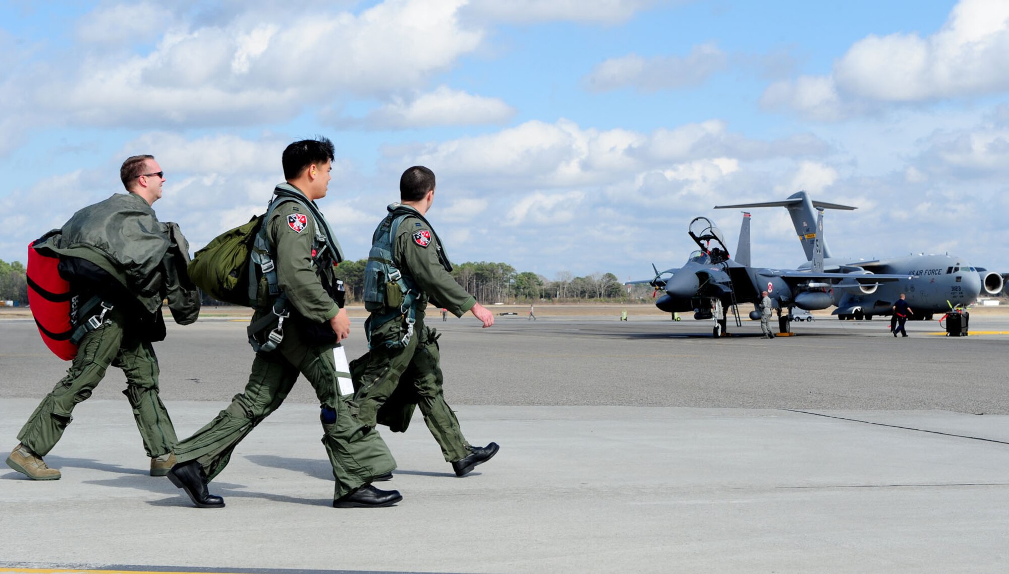 Joint Base Charleston, S.C.-- F-15E Strike Eagle pilots from the 333rd Fighter Squadron , Seymour Johnson AFB, N.C., step to their aircraft here, Feb. 25, 2011. (U.S. Air Force photo/Airman 1st Class Matthew Bruch)(RELEASED)
