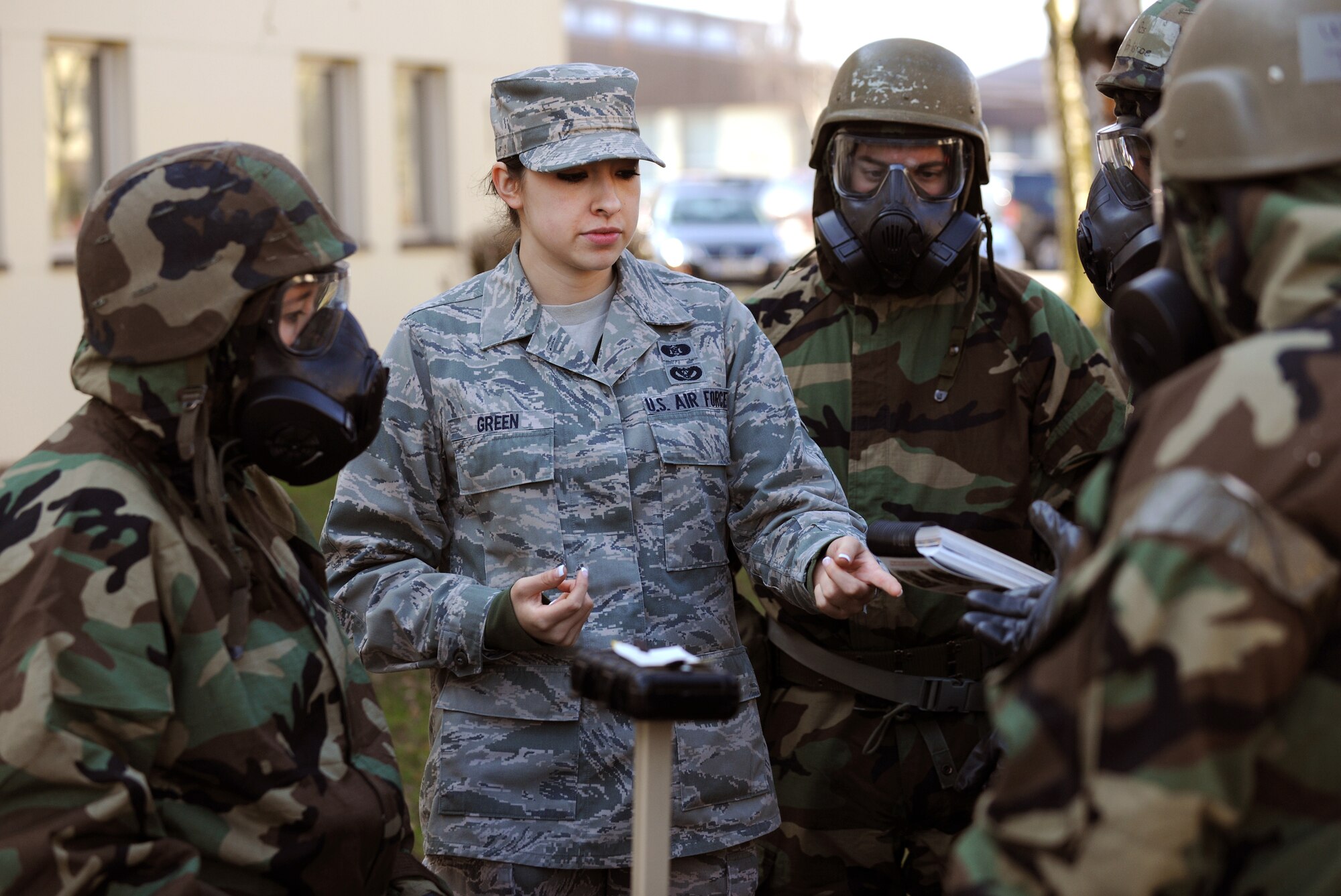 SPANGDAHLEM AIR BASE, Germany – Airman 1st Class Samantha Green, 52nd Civil Engineer Squadron Chemical, Biological, Radiological, Nuclear and Explosives Survival Skills Training instructor, asks students about different color results on M8 chemical agent detection paper during CBRNE Survival Skills Training here March 15. Survival Skills Training instructors teach students how to prepare for an attack, properly don individual protective gear and perform post-attack reconnaissance sweeps during the training. (U.S. Air Force photo/Senior Airman Nathanael Callon)