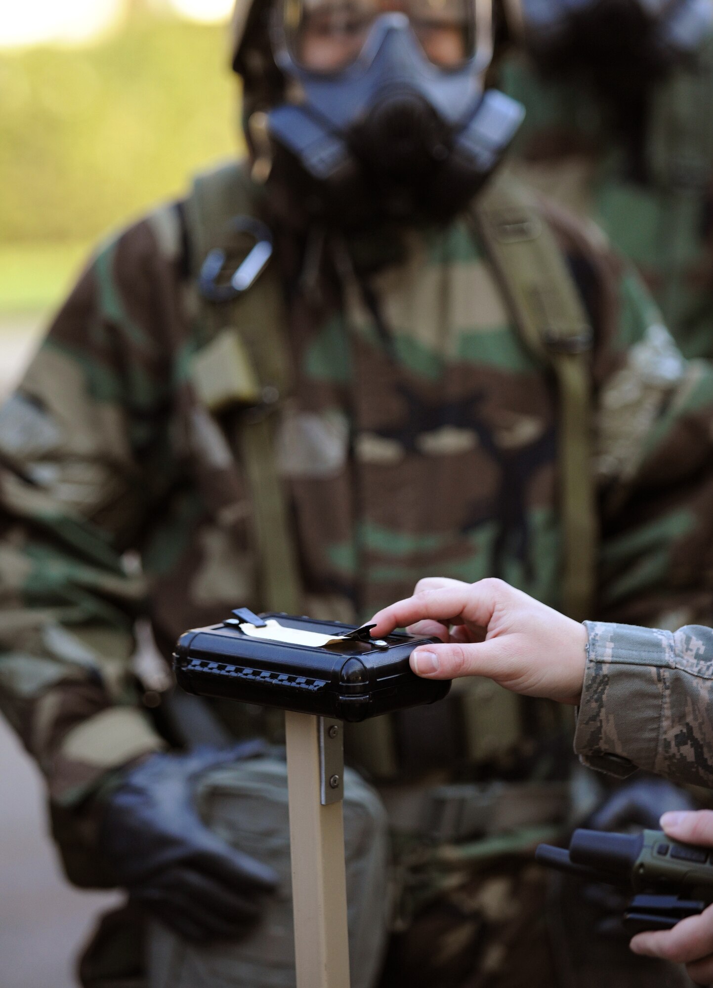 SPANGDAHLEM AIR BASE, Germany – Staff Sgt. Sylvia Pierce, 52nd Civil Engineer Squadron Chemical, Biological, Radiological, Nuclear and Explosives Survival Skills Training instructor, explains the different color results on M8 chemical agent detection paper during CBRNE Survival Skills Training March 15. Survival Skills Training instructors teach students how to prepare for an attack, properly don individual protective gear and perform post-attack reconnaissance sweeps during the training. (U.S. Air Force photo/Senior Airman Nathanael Callon)