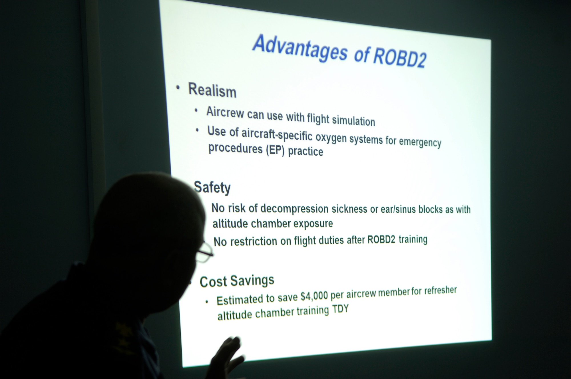 NEW AL-MUTHANA AIR BASE, Iraq – Iraq’s first fully-trained flight surgeon explains the details of the Iraqi air force’s first reduced oxygen breathing device here March 14. The U.S. Air force was able to procure two of the ROBD2 devices for the IqAF which will be used here and at Tikrit, Iraq, in place of the altitude chamber for pilot refresher training. (U.S. Air Force photo by Tech. Sgt. Randy Redman)