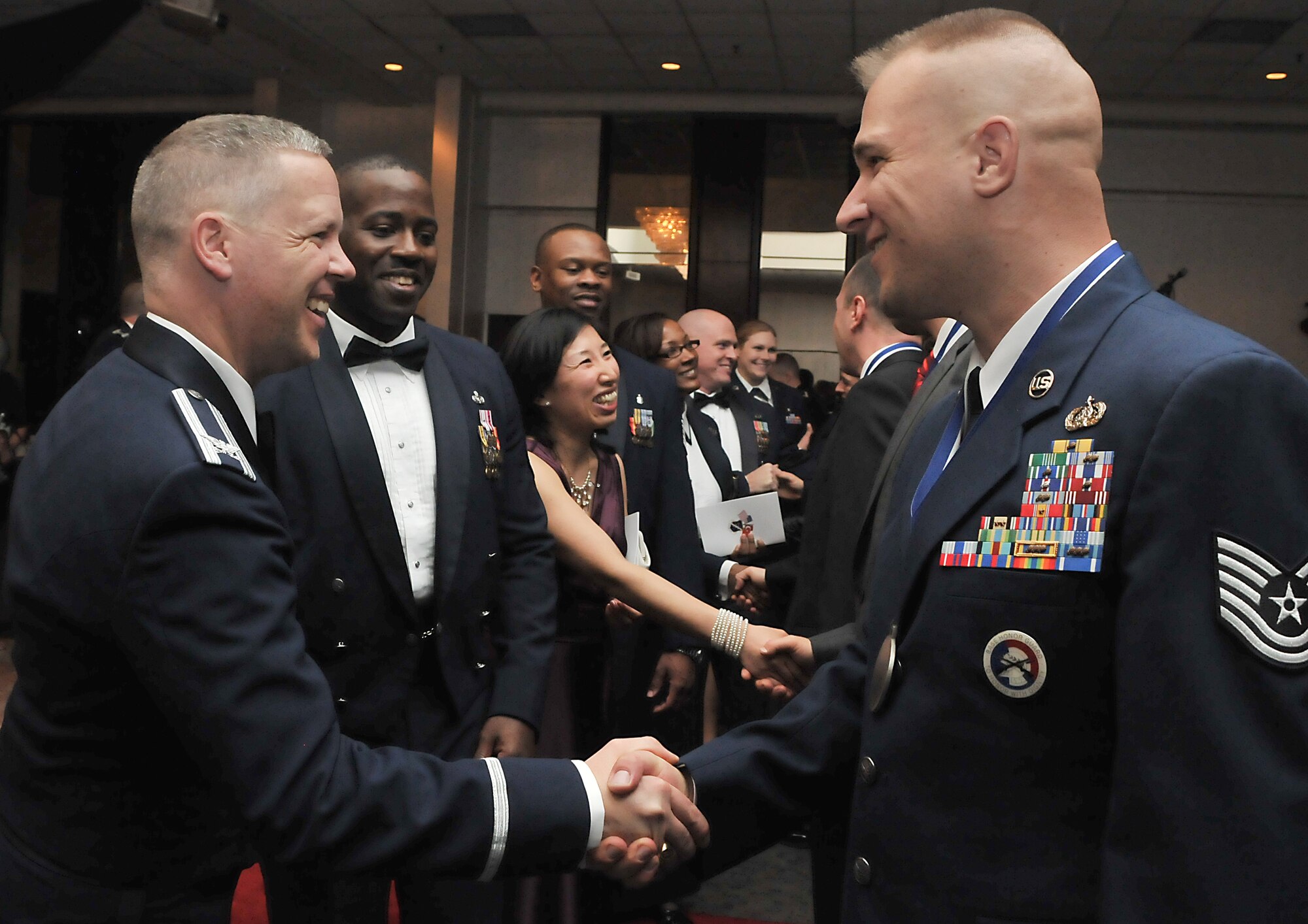 Col. Chad Butts, the 39th Air Base Wing vice commander, congratulates Tech. Sgt. Jerred Mitchell, from the 39th Communications Squadron, after the 2010 Incirlik Annual Awards ceremony Feb. 25, 2011, at Incirlik Air Base, Turkey. The annual awards banquet is held to honor Team Incirlik personnel who excelled in the 2010 calendar year. (U.S. Air Force photo by Staff Sgt. Alexandre Montes)