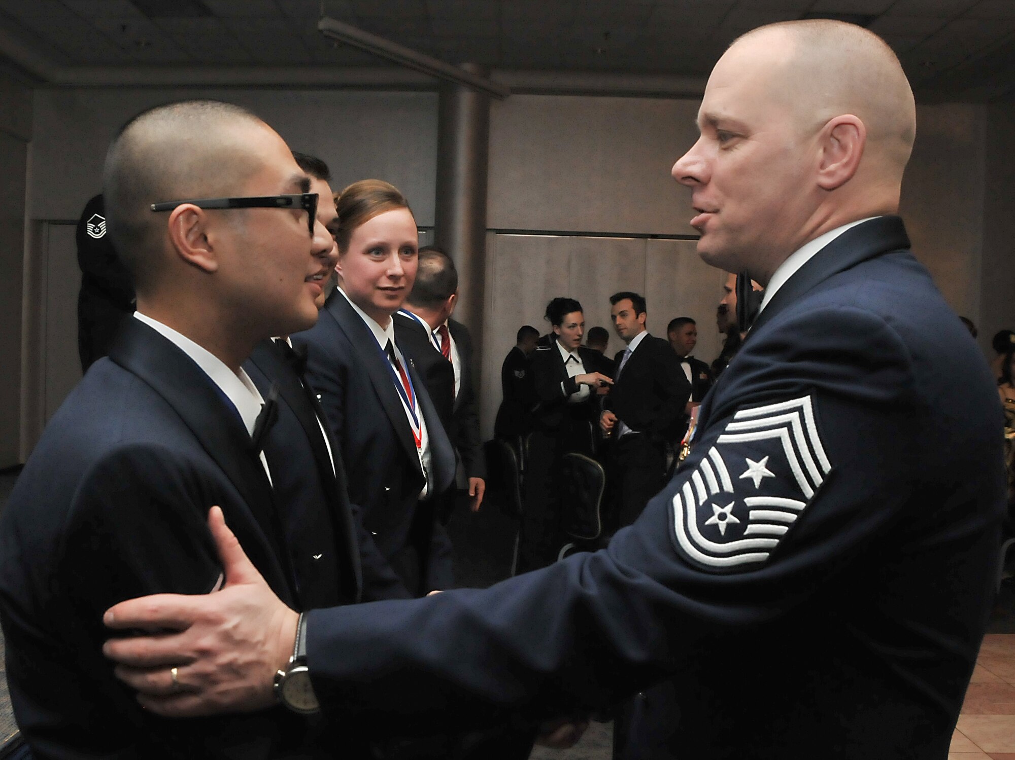 Chief Master Sgt. Dennis Vannorsdall, the 3rd Air Force command chief, congratulates Senior Airman Berlin Aniciete for winning Airman of the Year after the 2010 Incirlik Annual Awards ceremony Feb. 25, 2011, at Incirlik Air Base, Turkey. The annual awards banquet is held to honor Team Incirlik personnel who excelled in the 2010 calendar year. (U.S. Air Force photo by Staff Sgt. Alexandre Montes)