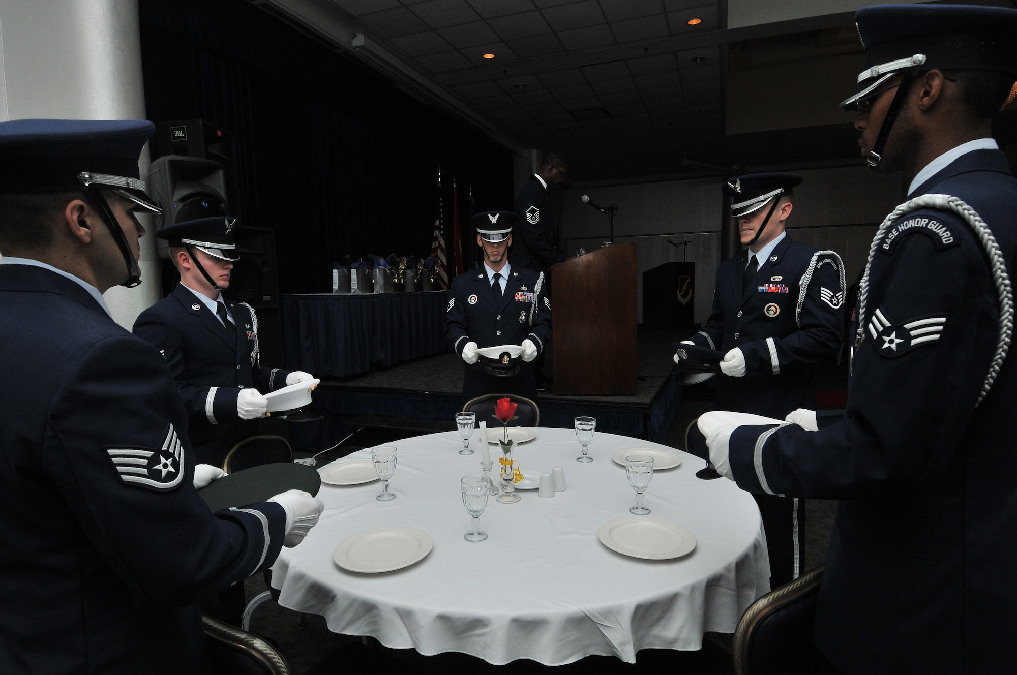 Members of the Incirlik Air Base Honor Guard perform the joint prisoners of war and missing in action table ceremony during the 2010 Incirlik Annual Awards ceremony Feb. 25, 2011, at Incirlik Air Base, Turkey. The annual awards banquet is held to honor Team Incirlik personnel who excelled in the 2010 calendar year. (U.S. Air Force photo by Staff Sgt. Alexandre Montes)