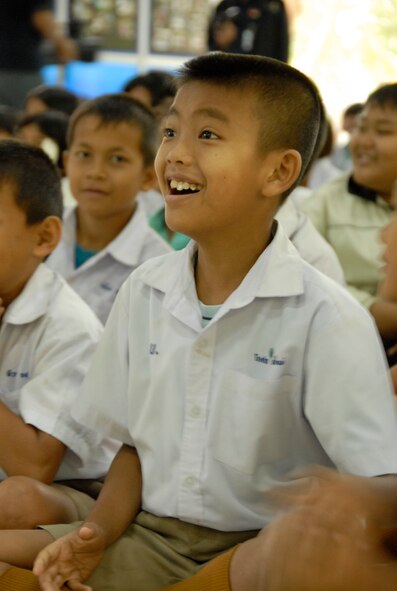 KORAT, Thailand - A student shows his enthusiasm as members of the Royal Thai Air Force Band entertain students at Ang Huai Yang School during a community outreach event in Korat, Thailand, March 16. Servicemembers from the U.S., Republic of Singapore, and Royal Thai Air Forces participated in the event while supporting Cope Tiger 2011, an annual, multilateral, joint field training exercise currently being conducted at Korat and Udon Thani Royal Thai Air Bases March 14 through 25. (U.S. Air Force Photo/ Capt. David Herndon)