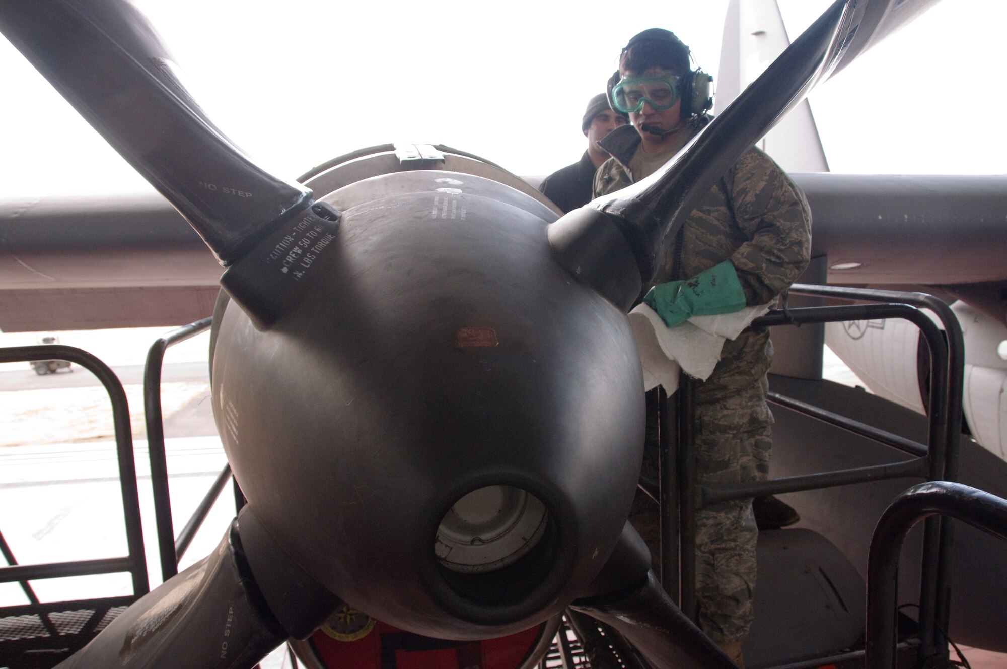 YOKOTA AIR BASE, Japan -- Airman 1st Class James Nicoloff, 374th Aircraft Maintenance Squadron turbo prop specialist, inspects a newly replaced C-130 Hercules propeller here March 16. If tasked, the aircraft will participate in the relief efforts in Northern Japan following the earthquake and tsunami that struck March 11. (U.S. Air Force photo/Airman 1st Class Krystal M. Garrett)