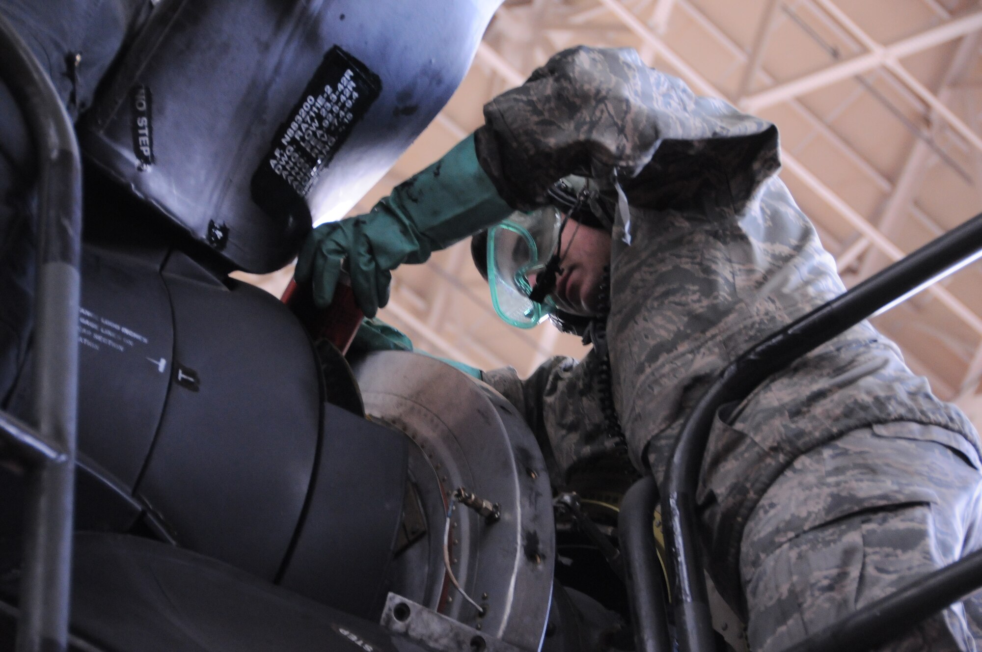 YOKOT A AIR BASE, Japan -- Airman 1st Class James Nicoloff, 374th Aircraft Maintenance Squadron turbo prop specialist, changes a damaged propeller on a C-130 Hercules here March 16. Airman Nicoloff prepares the aircraft for the support of the earthquake and tsunami relief efforts in Northern Japan. (U.S. Air Force photo/Airman 1st Class Krystal M. Garrett)