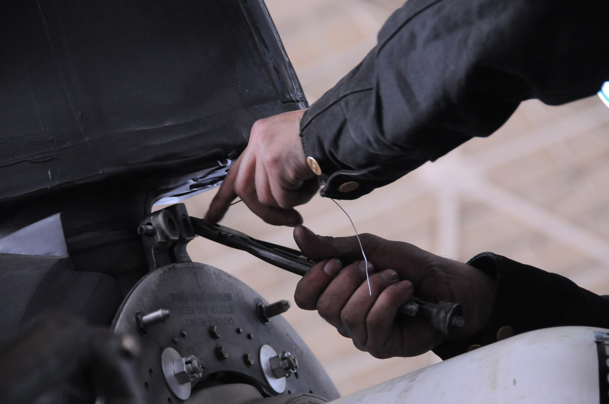 YOKOTA AIR BASE, Japan -- Senior Airman Kyle Chambasian, 374th Aircraft Maintenance Squadron turbo prop specialist, performs maintenance on a damaged propeller here March 16. Airman Chambasian replaces the damaged propeller to ensure the C-130 Hercules is mission ready, if called upon to support relief efforts in Northern Japan. (U.S. Air Force photo/Airman 1st Class Krystal M. Garrett) 