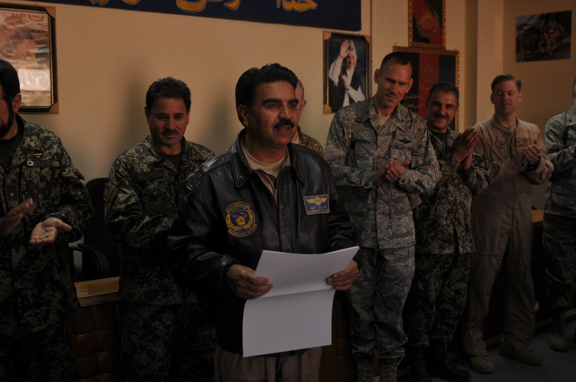 KABUL, Afghanistan -   An Afghan Air Force pilot displays his certificate for completing an aviation English language course at the AAF Base in Kabul March 14. The course, split between varying levels of language proficiency ranging from elementary to intermediate, taught aviation-centric English meant to help the airmanship of Afghan pilots and was sponsored by the British Council, a U.K. based organization specializing in international education and cultural opportunities. (U.S. Navy photo by Mass Communications Specialist 2nd Class Vladimir Potapenko) 