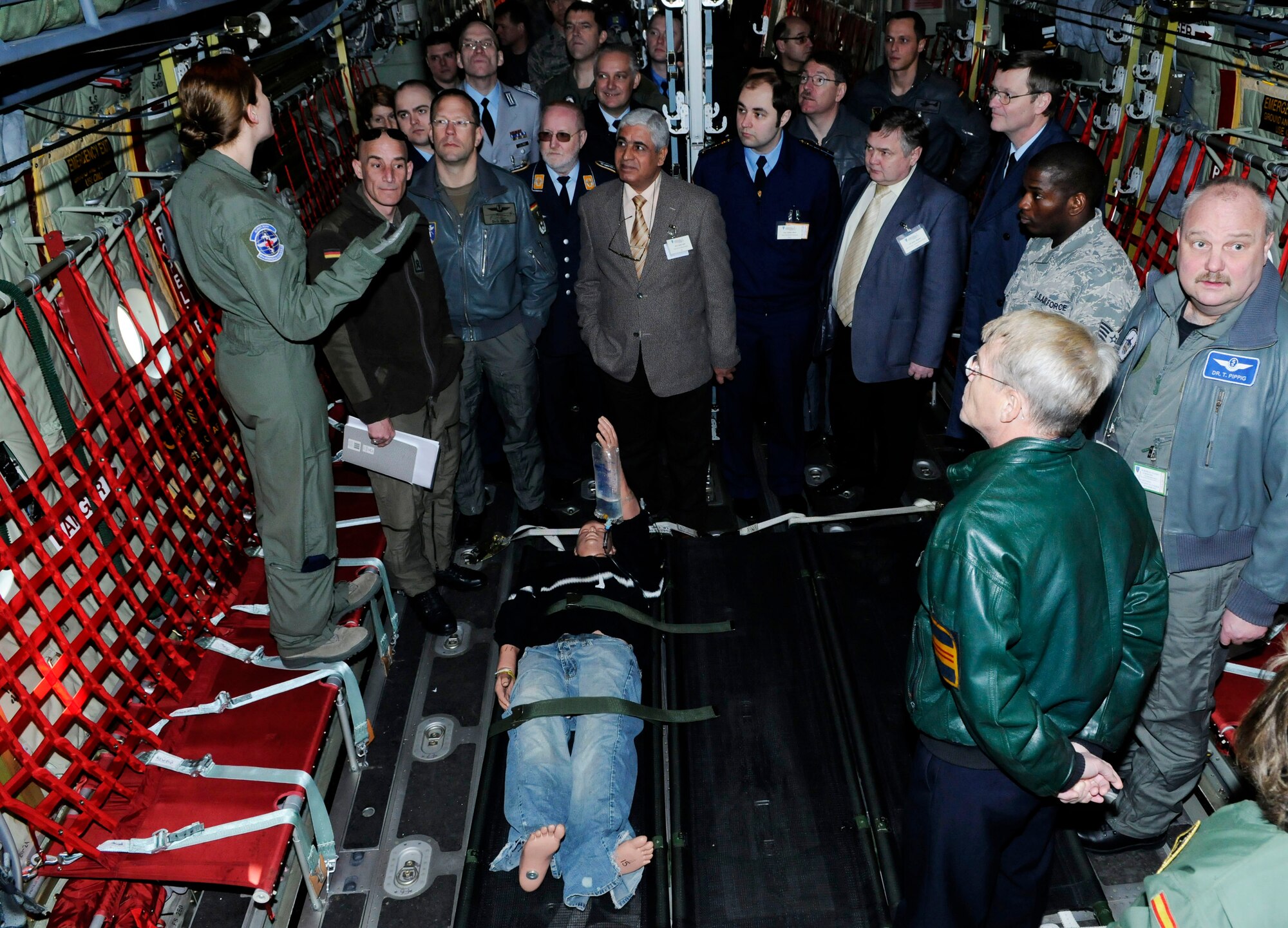 U.S. Air Force Senior Airman Teryn Granger, 86th Aeromedical Evacuation Squadron, explains critical patient care on a C-130 J aircraft during the 2011 European Flight Surgeons Conference, Ramstein Air base, Germany, March 15, 2011. The conference was held for military flight surgeons from North Atlantic Treaty Organization (NATO), partnership for peace and DoD component services in Europe and focused on building partnerships and advancements in the Aeromedical Evacuation and Critical Care Air Transport community. (U.S. Air Force photo by Airman 1st Class Desiree Esposito) 