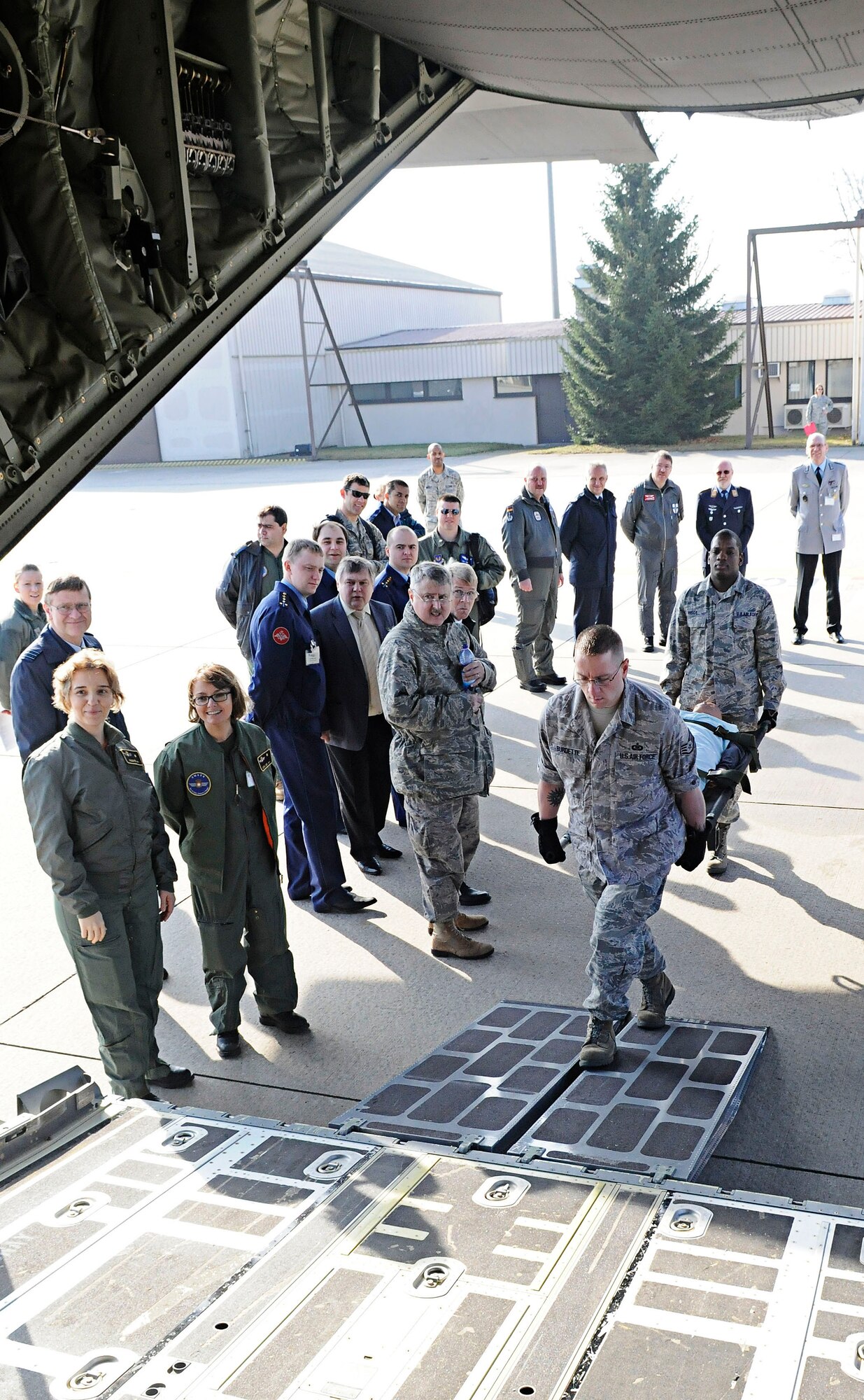 U.S. Air Force 86th Aeromedical Evacuation Squadron personnel demonstrate procedures for loading critical patients during the 2011 European Flight Surgeons Conference, Ramstein Air Base, Germany, March 15, 2011. The focus of the conference this year was building partnerships and developing advancements in Aeromedical Evacuation and Critical Care Air Transport. (U.S. Air Force photo by Airman 1st Class Desiree Esposito)