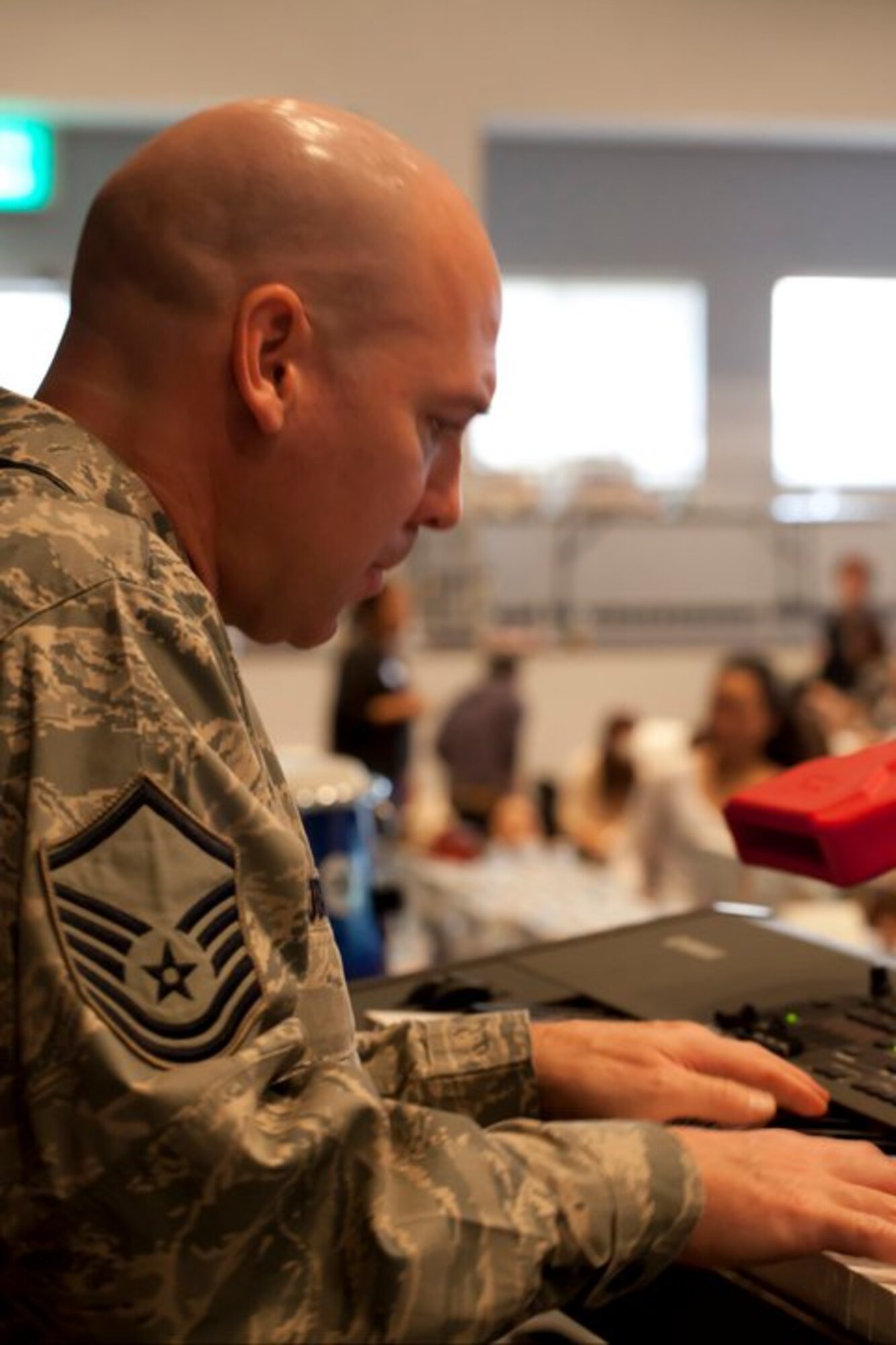 MSgt Vinnie Dublino takes a moment to look down while performing a
heart-warming keyboard solo. (Courtesy photo)
