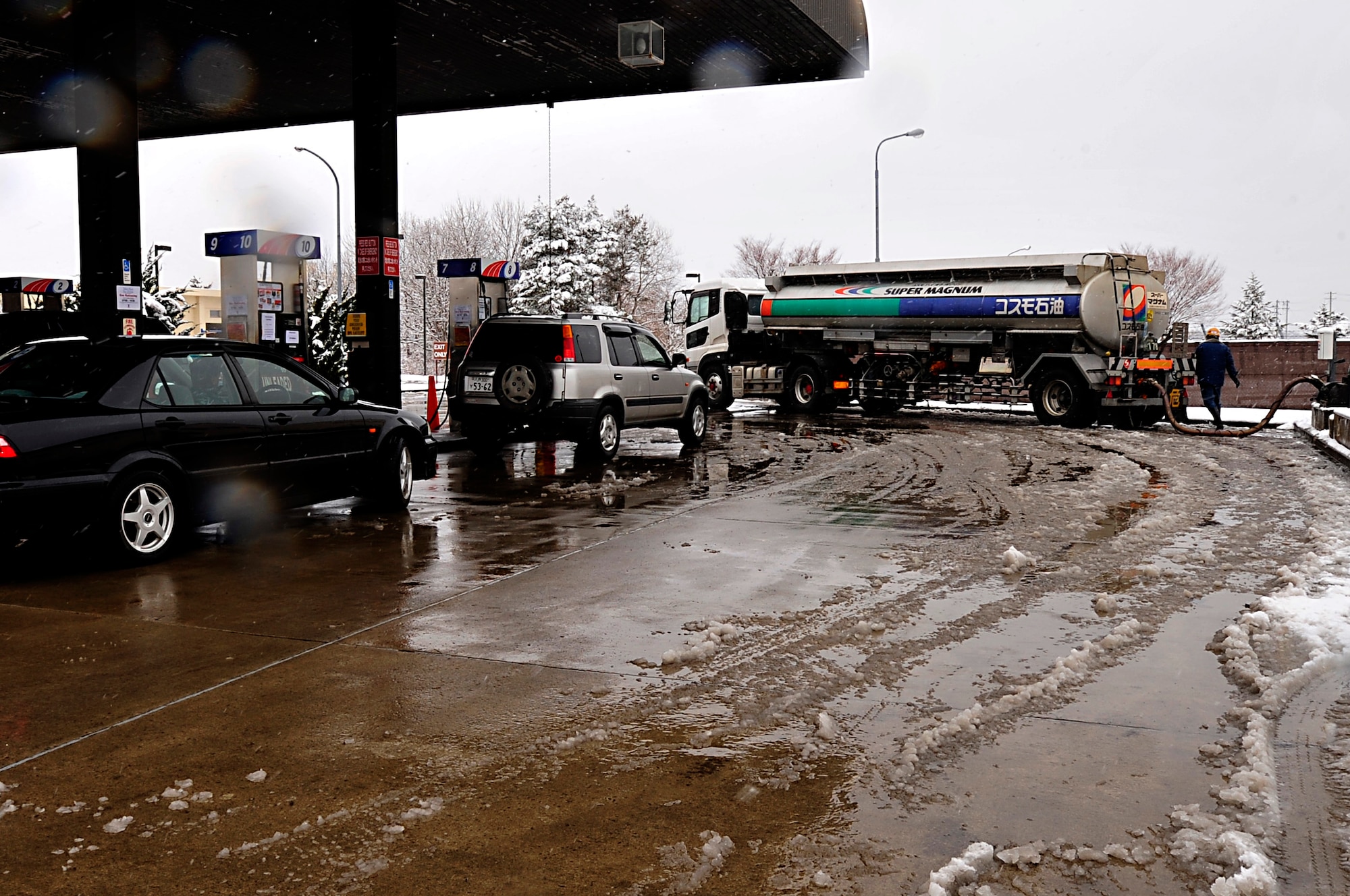 MISAWA AIR BASE, Japan -- A commercial fuel trucks refuels the base supply tanks Mar. 16. Base residents need to keep in mind conservation while being authorized ten gallons of gasoline per vehicle as long as it contains less than a quarter of a tank. (U.S. Air Force photo by Staff Sgt. Marie Brown\Released)