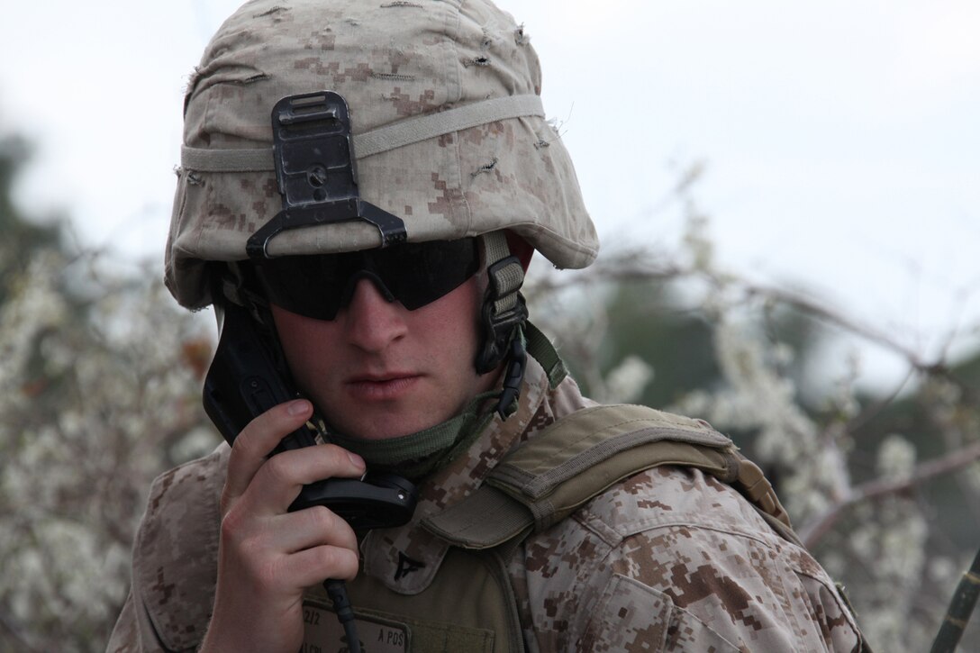 Lance Corporal Derek Tomlin, a mortar forward observer with Easy Company, Battalion Landing Team, 2nd Battalion, 2nd Marine Regiment, 22nd Marine Expeditionary Unit, calls in indirect-fire support during a fire support capabilities exercise aboard Marine Corps Base Camp Lejeune, N.C., March 16, 2011. The exercise provided training for the fire support teams whom coordinate close-air and indirect-fire support for the companies.  The Marines and sailors of the 22nd MEU deployed with Amphibious Squadron 6 aboard the USS Bataan Amphibious Ready Group March 29, 2011, and will continue to train and test the MEU’s ability to operate as a cohesive and effective Marine Air Ground Task Force.  The 22nd MEU is a multi-mission capable Marine Air Ground Task Force comprised of Aviation Combat Element, Marine Medium Tilt Rotor Squadron 263 (Reinforced); Logistics Combat Element, Combat Logistics Battalion 22; Ground Combat Element, Battalion Landing Team, 2nd Battalion, 2nd Marine Regiment; and its command element.
