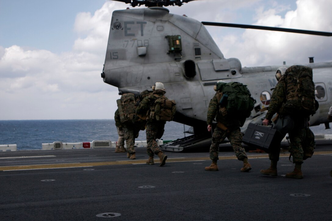 Marines with the 31st Marine Expeditionary Unit forward command element board a CH-46E Sea Knight helicopter on route to Japan. The Marines headed to set up the 31st MEU’s FCE for continued operations in Japan. The 31st MEU continues to prepare to provide humanitarian assistance in support of Operation Tomodachi.  Marines and sailors of the 31st MEU are making preparations for disaster relief efforts after a 9.0 earthquake and subsequent tsunami struck Japan causing widespread damage. The 31st MEU is the nations’ force in readiness in the Asia Pacific region.
