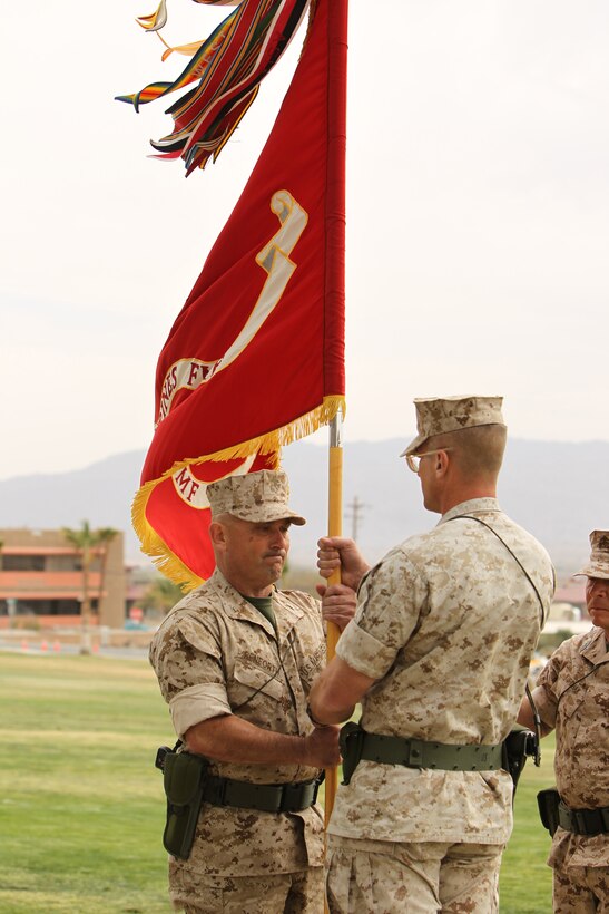 Col. Austin E. Renforth, the incoming commanding officer of 7th Marine Regiment, accepts the unit’s battle colors from Col. Randall P. Newman, the outgoing commander, symbolically taking command of the ‘Magnificent 7th’ during a Change of Command Ceremony at Lance Cpl. Torrey L. Gray Field March 17, 2011.::r::::n::