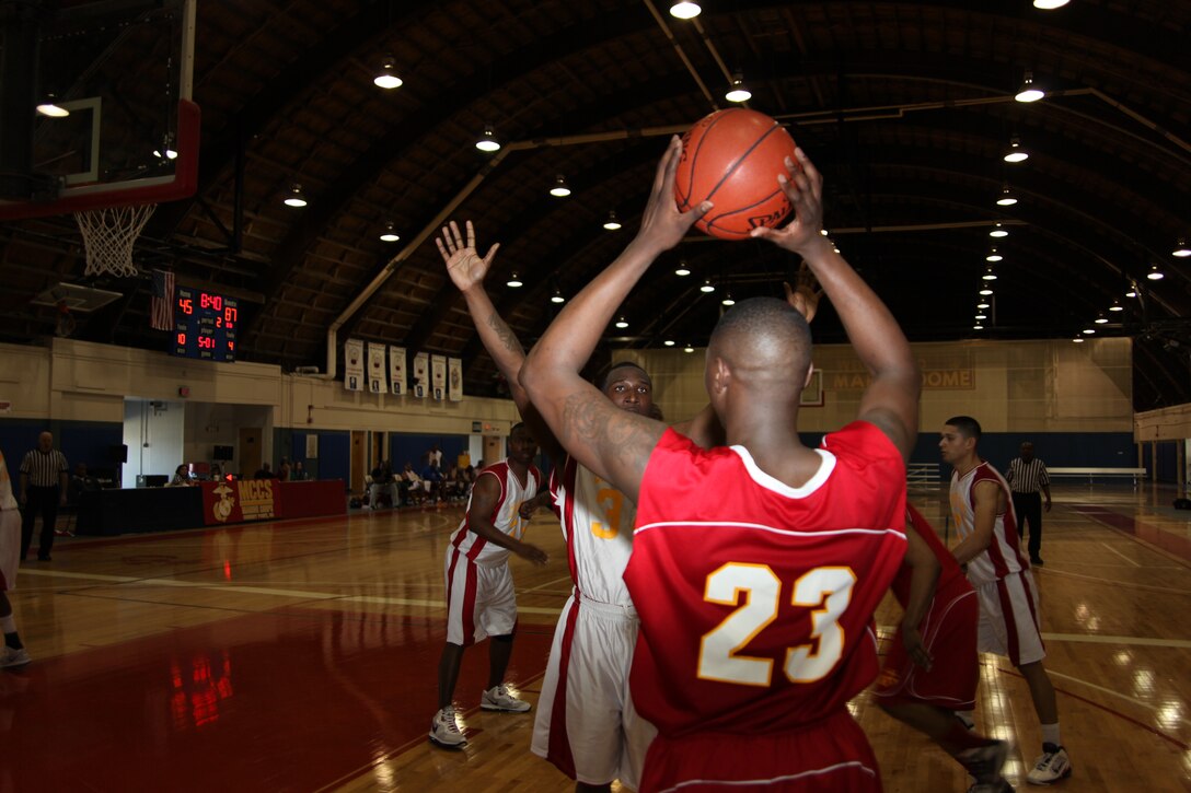 National Capitol Region guard Willie Nathan looks to inbound the ball in a round-robin game against Marine Corps Base Camp Lejeune during the East Coast Regional Basketball Tournament at the Marine Dome March 17-19. NCR is made up of Washington D.C. area Marine Corps commands to include Quantico, last year’s defending champions. NCR won the tournament in the final game of the single elimination tournament against Marine Corps Air Station New River 86-70.