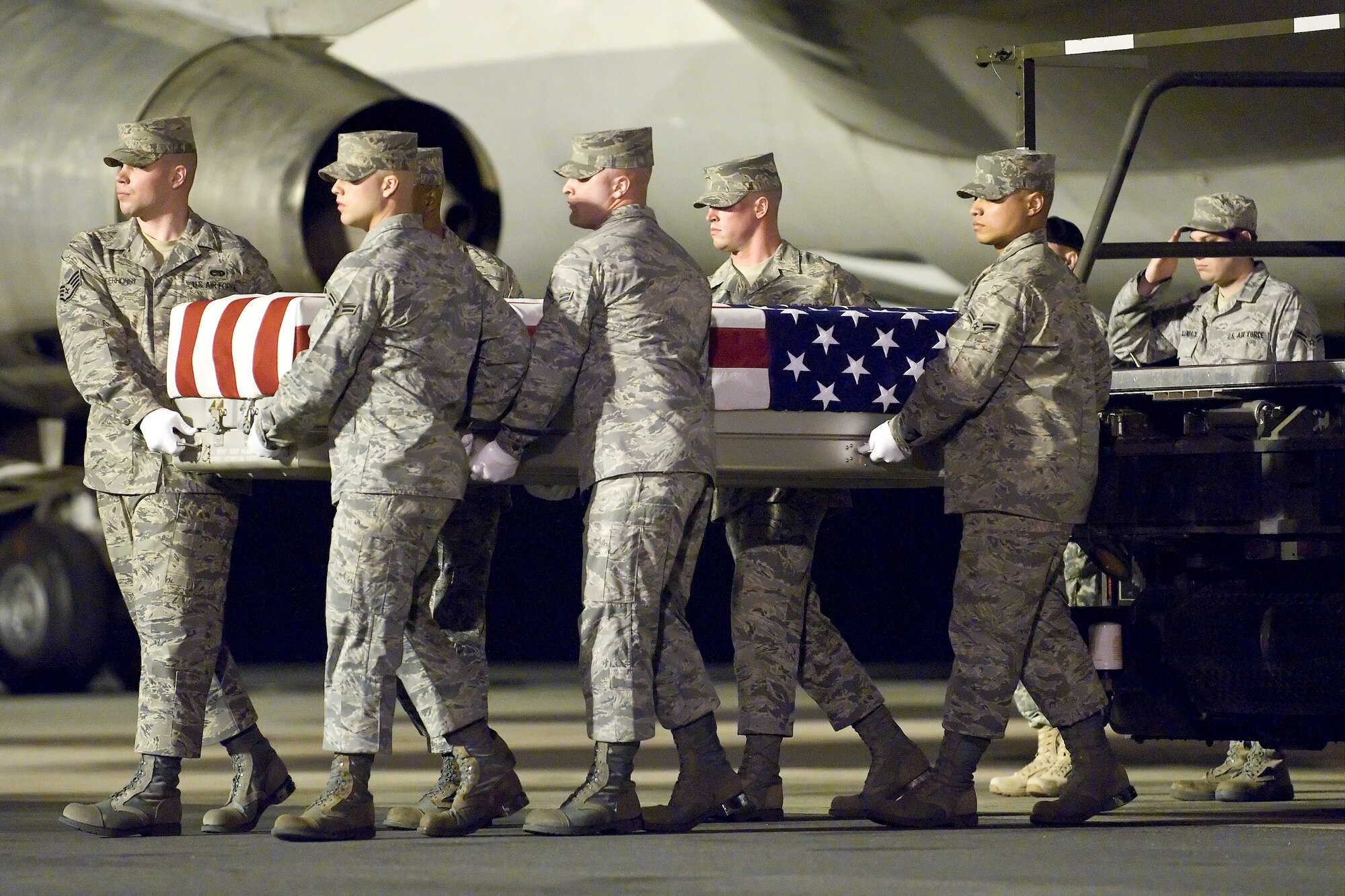 A U.S. Air Force carry team transfers the remains of Air Force Senior Airman Michael J. Hinkle II, of Corona, Calif., at Dover Air Force Base, Del., March 17, 2011. Hinkle was assigned to the 28th Communications Squadron, Ellsworth Air Force Base, S.D. (U.S. Air Force photo/Roland Balik)
