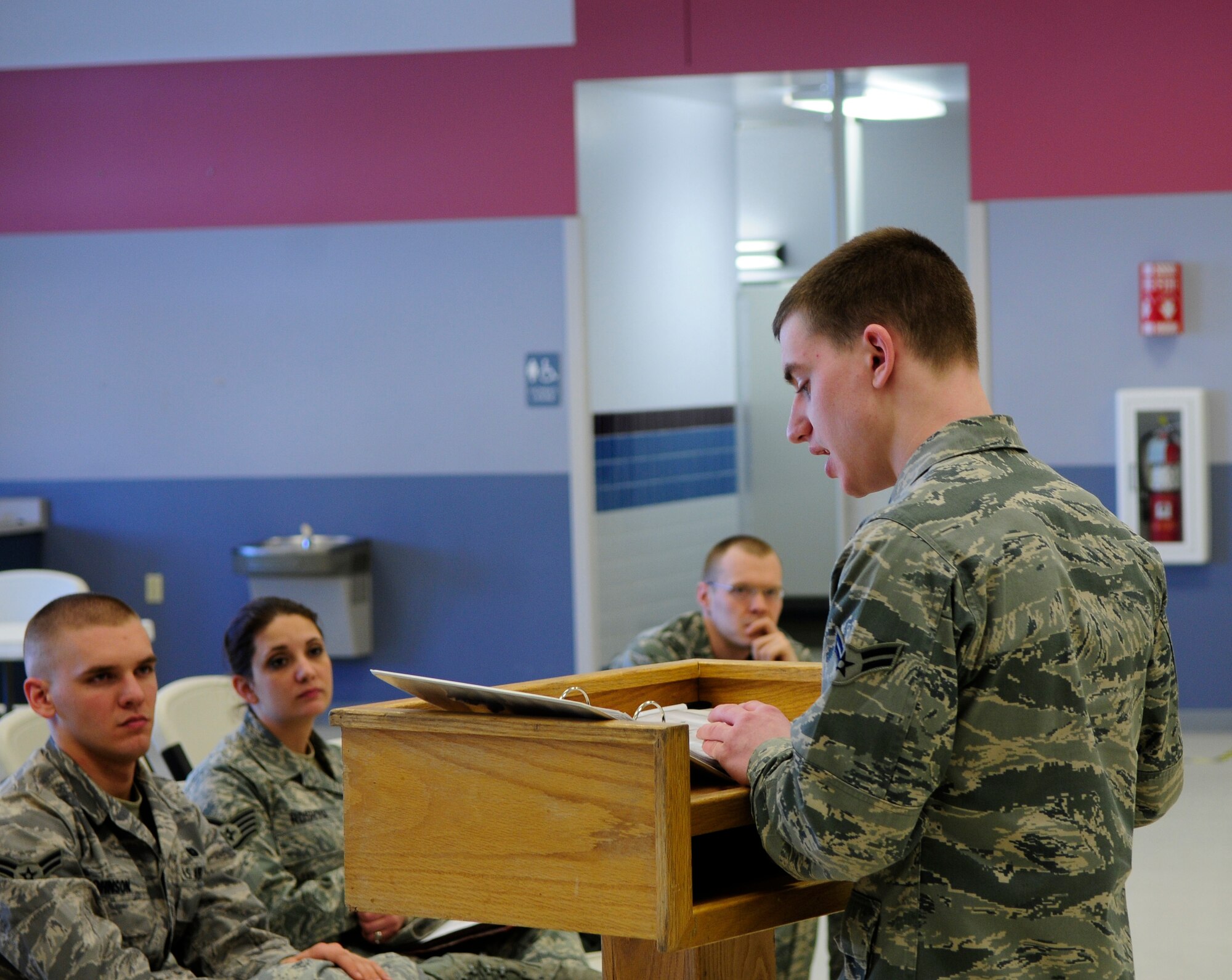 Airman 1st Class Nicholas Komor gives a deployment briefing March 17, 2011, Eielson Air Force Base, Alaska.  Airmen who received orders for deployment to Japan will assist in humanitarian relief capabilities. Airman Komor is assigned to the 354th Force Support Squadron Military Personnel Section.  (U.S. Air Force photo by/Airman 1st Class Yash Rojas)