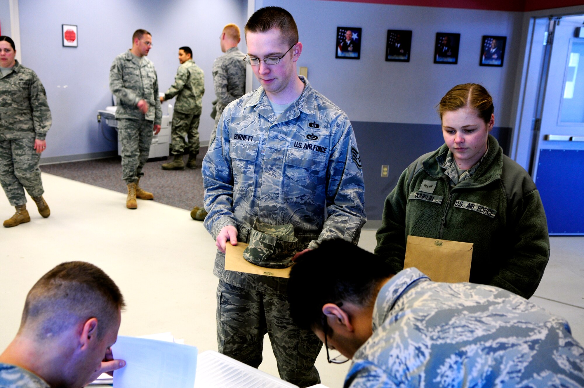 Staff Sgt. John Burnett prepares to deploy to Japan March 17, Eieslon Air Force Base, Alaska.  Airmen who received orders processed through Eielson Joint Mobility Complex before assiting in humanitarian relief in Japan.  Sergeant Burnett is assigned to the 354th Civil Engineer Squadron as the NCO in charge of emergency management.  (U.S. Air Force photo by/Airman 1st Class Yash Rojas)