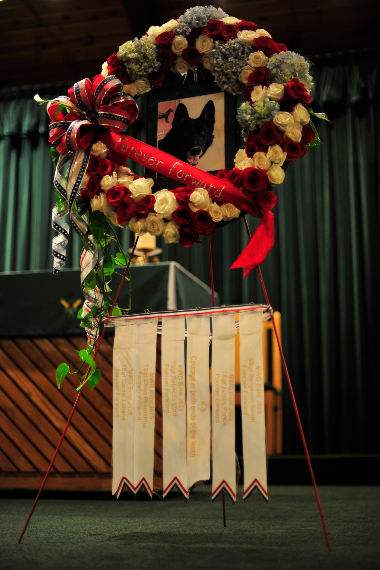 A wreath for a military working dog is on display during a memorial service at the base chapel at Hurlburt Field, Fla., March 8, 2011. MWD Beto, a narcotics detection dog assigned to the 1st Special Operations Security Forces Squadron, died of natural causes while serving in Operation Enduring Freedom. (U.S. Air Force photo by Staff Sgt. Stephanie Jacobs / RELEASED)