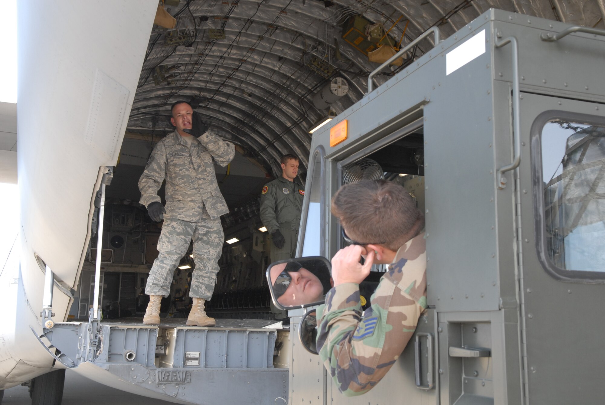 VANDENBERG AIR FORCE BASE, Calif. - Members of the 30th Logistics Readiness Squadron Transportation Management Office, prepare pallets of boric acid for shipment to Japan on Thursday March, 17, 2011. Approximately 34,000 pounds of boric acid from the Diablo Canyon Power Plant is being sent to aid in the cooling of Japan's Fukushima Daiichi Nuclear Complex. Boric acid is used in nuclear power plants to control the fission rate of uranium. (U.S. Air Force photo/ Jerry E. Clemens, Jr.)