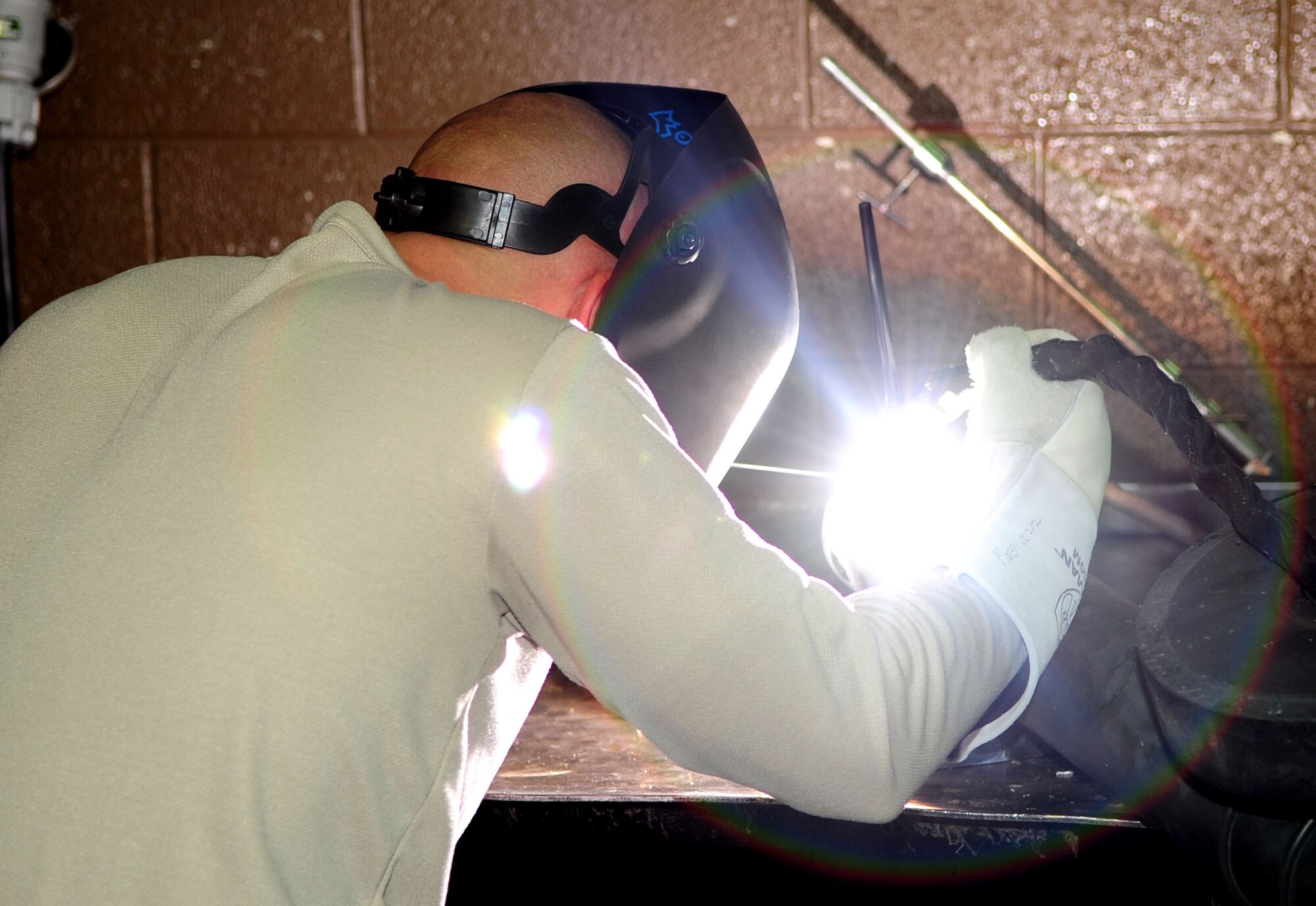 DAVIS-MONTHAN AIR FORCE BASE, Ariz.-Tech. Sgt. Michael Marsh, a metals technician from the 355th Equipment Maintenance Squadron, welds an A-10 tow bar here Jan. 31. (U.S. Air Force photo/Airman 1st Class Jerilyn Quintanilla)