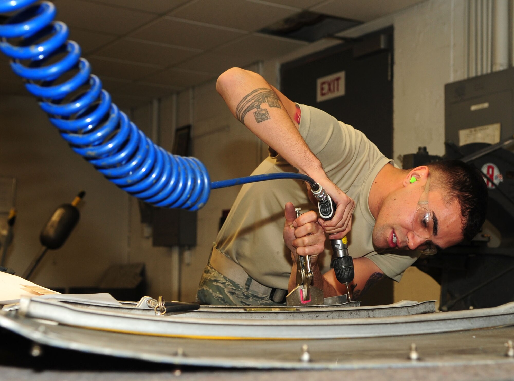DAVIS-MONTHAN AIR FORCE BASE, Ariz. - Airman 1st Class Giantonio Cintron, a structural maintainer from the 355th Equipment Maintenance Squadron, drills an L-angle for a C-130 engine cowl door here Jan. 31. (U.S. Air Force photo/Airman 1st Class Jerilyn Quintanilla)
