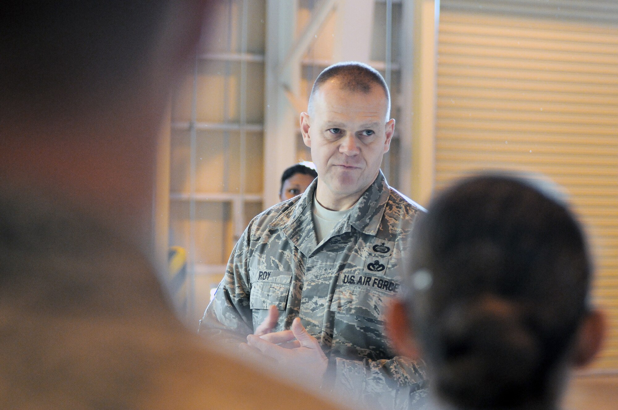 Chief Master Sgt. of the Air Force James Roy visits 374th Logistics Readiness Squadron members Dec. 28, 2010, during his visit to Yokota Air Base, Japan. Chief Roy visited Yokota AB as part of his tour of the Pacific. (U.S. Air Force photo/Airman 1st Class Katrina R. Menchaca)