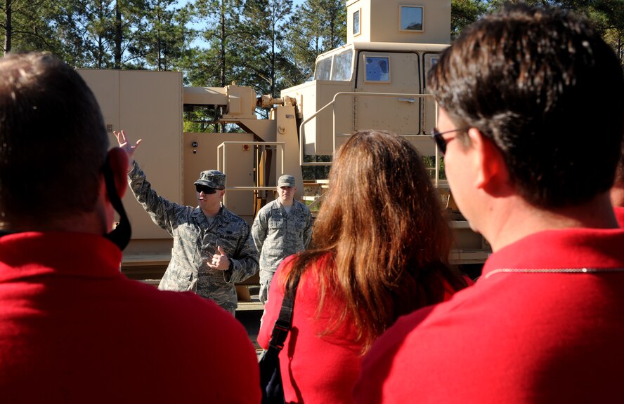 MOODY AIR FORCE BASE, Ga.-- 1st Lt. Joshua Croteau, 820th Combat Operations Squadron operations support officer in charge, explains the use of the Humvee egress assistance trainer to members of Leadership Lowndes class of 2011 March 17. Community leaders from Lowndes County had the opportunity to tour Moody and learn more about the base. (U.S. Air Force photo/Airman 1st Class Benjamin Wiseman)(RELEASED)