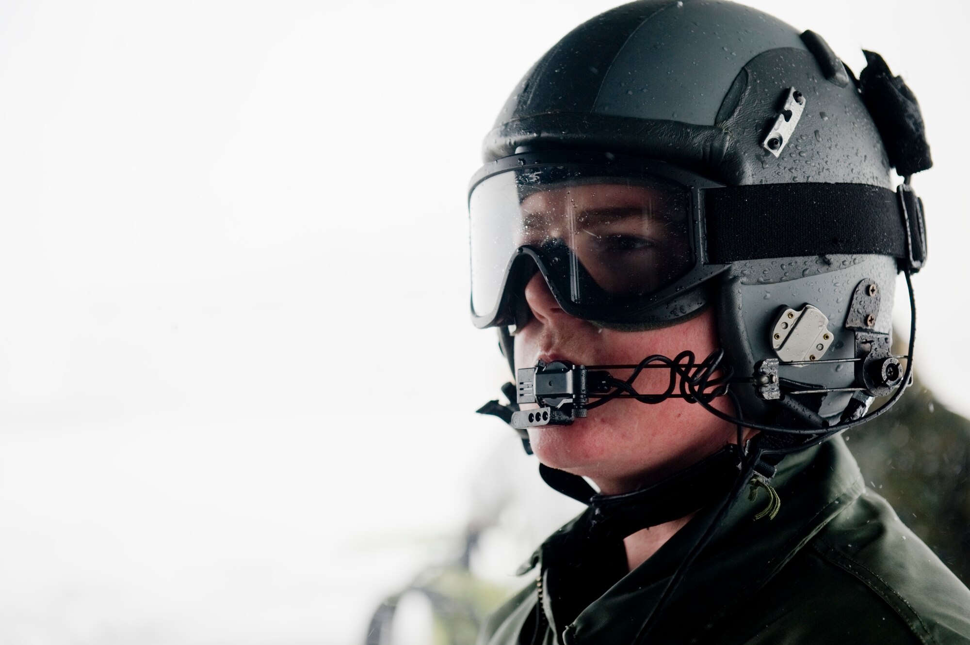 YAMAGATA, Japan--Airmen 1st Class JT Mills, 17th Special Operations Squadron loadmaster, keeps in communication with the pilots and forward area refueling point (FARP) members while defueling a MC-130P Combat Shadow at Yamagata Airport March 17. The FARP members defueled the MC-130P and fueled four fuel bladders worth 36,000 pounds of JP-8 fuel. FARPs allow aircraft to operate at distances further from original airport that it took off by allowing the aircraft to stop and refuel where typically no fuel is at.  The FARP team is capable of providing fuel to remote and austere locations. The fuel at Yamagata Airport will be used for American forces search and recovery teams during Japans earthquake and tsunami relief. (U.S. Air Force photo/ Staff Sgt. Jonathan Steffen)
