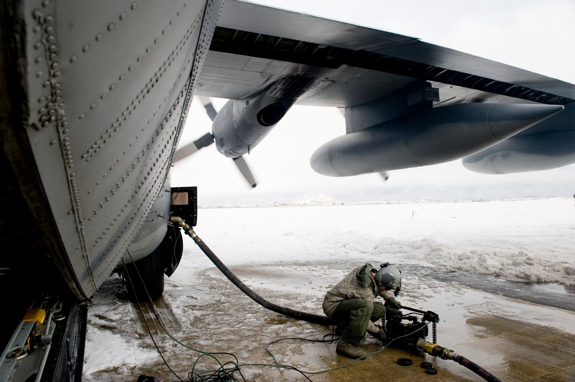 Yamagata, Japan--Staff Sgt. Nicholas Wisnoski, 17th Special Operations Squadron loadmaster, turns off a defueling pump an a MC-130P Combat Shadow March 17. The FARP members defueled the MC-130P and fueled four fuel bladders worth 36,000 pounds of JP-8 fuel. FARPs allow aircraft to operate at distances further from original airport that it took off by allowing the aircraft to stop and refuel where typically no fuel is at.  The FARP team is capable of providing fuel to remote and austere locations. The fuel at Yamagata Airport will be used for American forces search and recovery teams during Japans earthquake and tsunami relief. (U.S. Air Force photo/ Staff Sgt. Jonathan Steffen)
