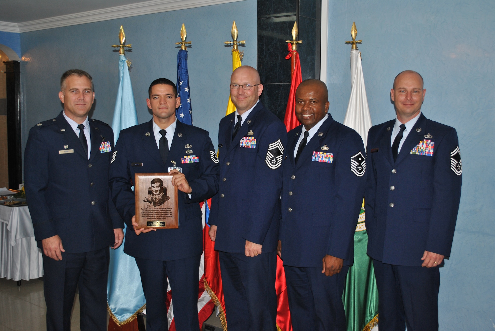 SOTO CANO AIR BASE, Honduras - 612th Air Base commander Lt. Col. Cade, Tech. Sgt. Antonio Araiza, 612th ABS senior enlisted Chief Master Sgt. Schwenk, 612th ABS first sergeant Master Sgt. Emmit Bartee and Senior Master Sgt. Ricky Herring take a photo together after Sergeant Araiza is recognized as the John Levitow Award winner during the Non-Commissioned Officer Academy graduation in Bogoata, Colombia Mar. 3. Sergeant Araiza went to the academy from the 612 Air Base Squadron and completed the 228-hour course entirely in Spanish. Joint Task Force-Bravo and Soto Cano Air Base are committed to full partnerships with Central American governments in training and missions to support security, stability and prosperity throughout the region. (U.S. Air Force photo/Master Sgt. Emmit Bartee)