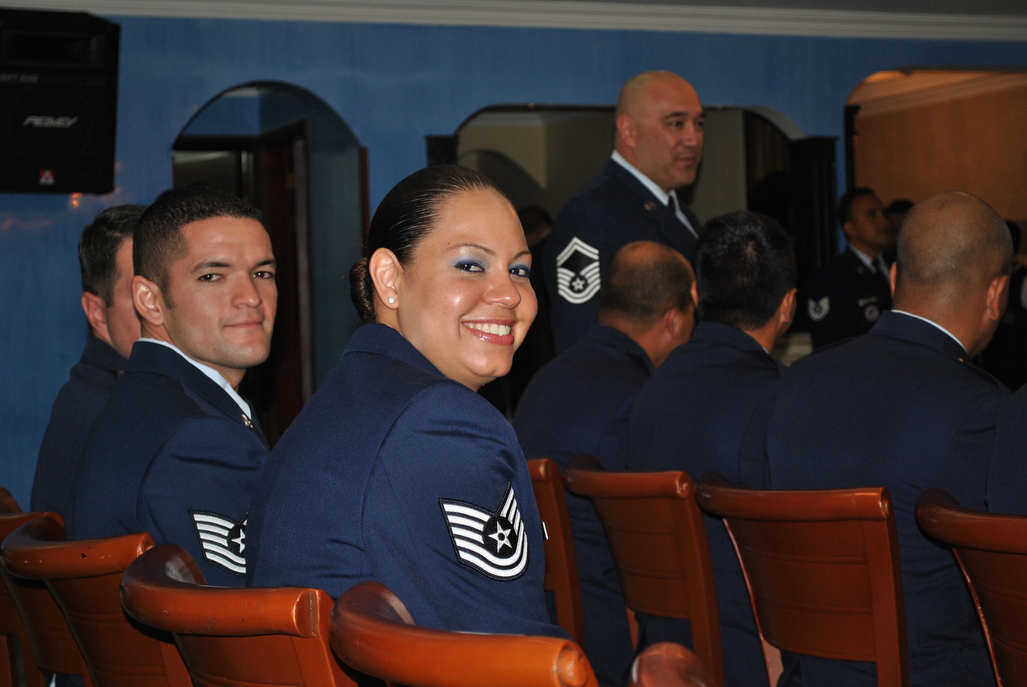 SOTO CANO AIR BASE, Honduras - Tech Sgts. Antonio Araiza and Rebeca Rosado take their seats and prepare for graduation from the Non-Commissioned Officer Academy in Bogoata, Colombia Mar. 3. Sergeant Araiza went to the academy from the 612 Air Base Squadron, completed the 228-hour course entirely in Spanish and was recognized as both Distinguished Graduate and John Levitow Award winner. Joint Task Force-Bravo and Soto Cano Air Base are committed to full partnerships with Central American governments in training and missions to support security, stability and prosperity throughout the region. (U.S. Air Force photo/Master Sgt. Emmit Bartee)