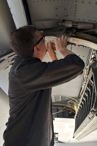 SEYMOUR JOHNSON AIR FORCE BASE, N.C.- Wayne Wuori, 911th Air Refueling Squadron aircraft structure maintenance technician, inspects the cove-lip door on a KC-135R Stratotanker here, March 16, 2011. The mission of the 911th ARS is to organize, train and equip KC-135R/T personnel and aircraft for deployment, aerial refueling and airlift operations in support the United States and its allies. Mr. Wuori hails from Jay, Maine. (U.S. Air Force photo/Senior Airman Whitney Lambert) (RELEASED)