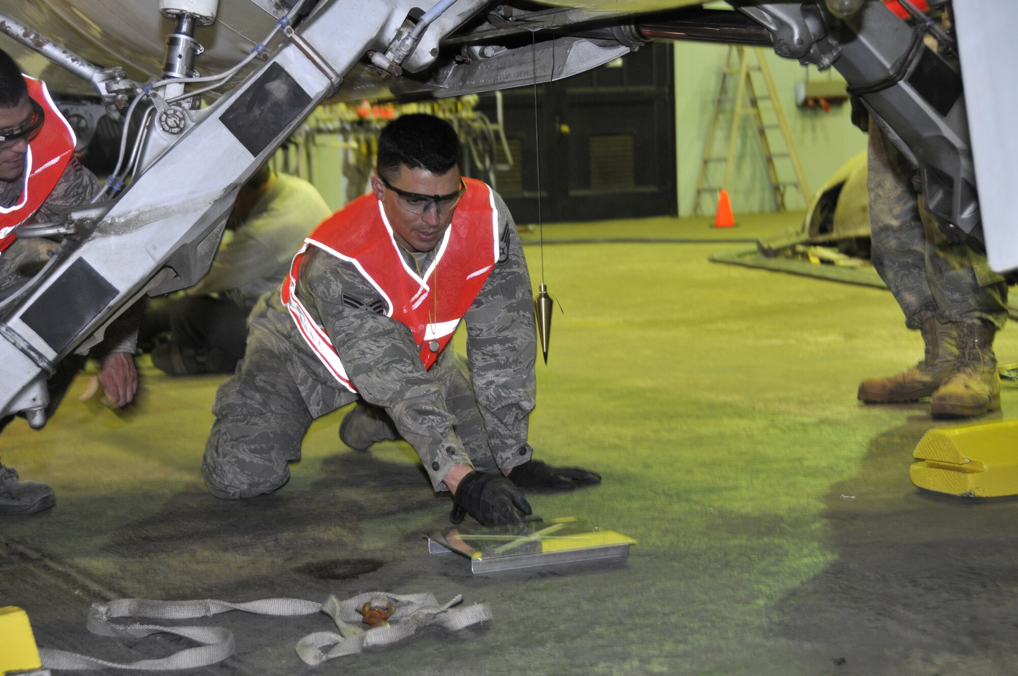 Staff Sgt. Wesley Hammond, an aircraft maintenance technician assigned to the 129th Maintenance Squadron, observes a plumb bob that indicates the position and balance of TF-104G aircraft as it is slowly raised by airbags under the aircraft. Airmen from the 129th Rescue Wing conducted a full-scale airbag lift exercise using a TF-104G static display to simulate a downed aircraft at Moffett Federal Airfield, Calif., Mar. 15, 2011.  (Air National Guard photo by Tech. Sgt. Ray Aquino/RELEASED)

More information about the TF-104G is available at http://www.nationalmuseum.af.mil/factsheets/factsheet.asp?id=2313.