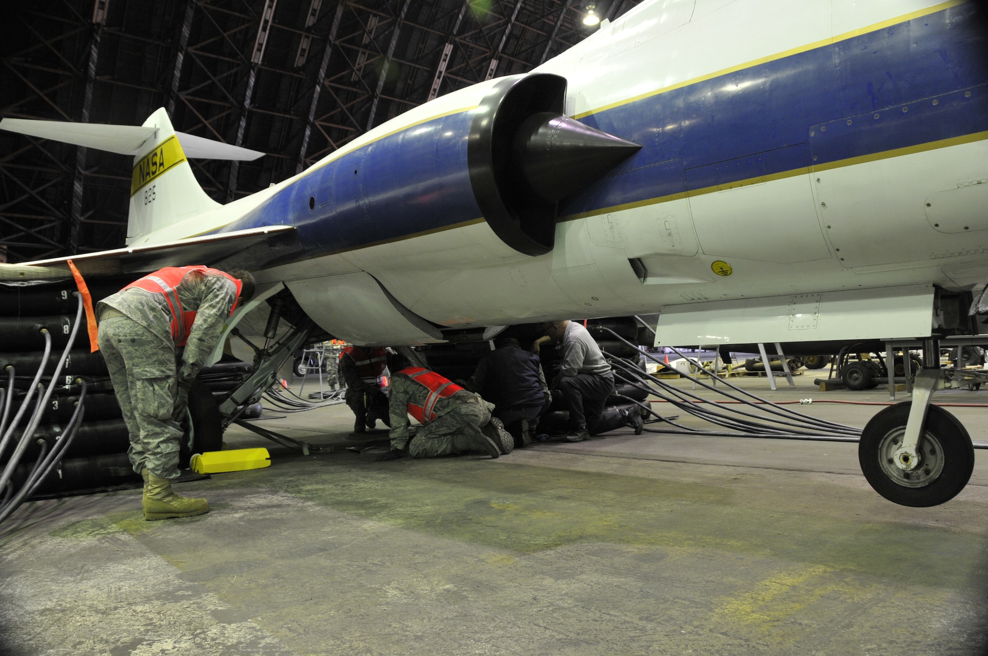 Aircraft maintenance personnel assigned to the 129th Maintenance Squadron inspect the main landing gears of a TF-104G for leaks and discrepancies. Airmen from the 129th Rescue Wing conducted a full-scale airbag lift exercise using a TF-104G static display to simulate a downed aircraft at Moffett Federal Airfield, Calif., Mar.
15, 2011.  (Air National Guard photo by Tech. Sgt. Ray Aquino/RELEASED)

More information about the TF-104G is available at http://www.nationalmuseum.af.mil/factsheets/factsheet.asp?id=2313.