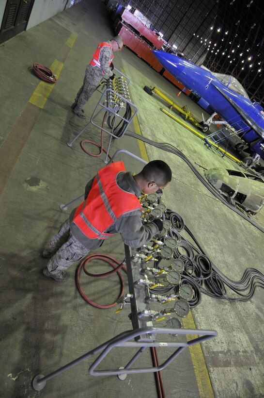 Tech. Sgt. Andrew Ciampia and Airman 1st Class Vandy Chan, aircraft maintenance personnel assigned to the 129th Maintenance Squadron, operate the control that stabilizes the airbag manifold under a TF-104G aircraft. Airmen from the 129th Rescue Wing conducted a full-scale airbag lift exercise using a TF-104G static display to simulate a downed aircraft at Moffett Federal Airfield, Calif., Mar.
15, 2011.  (Air National Guard photo by Tech. Sgt. Ray Aquino/RELEASED)

More information about the TF-104G is available at http://www.nationalmuseum.af.mil/factsheets/factsheet.asp?id=2313.