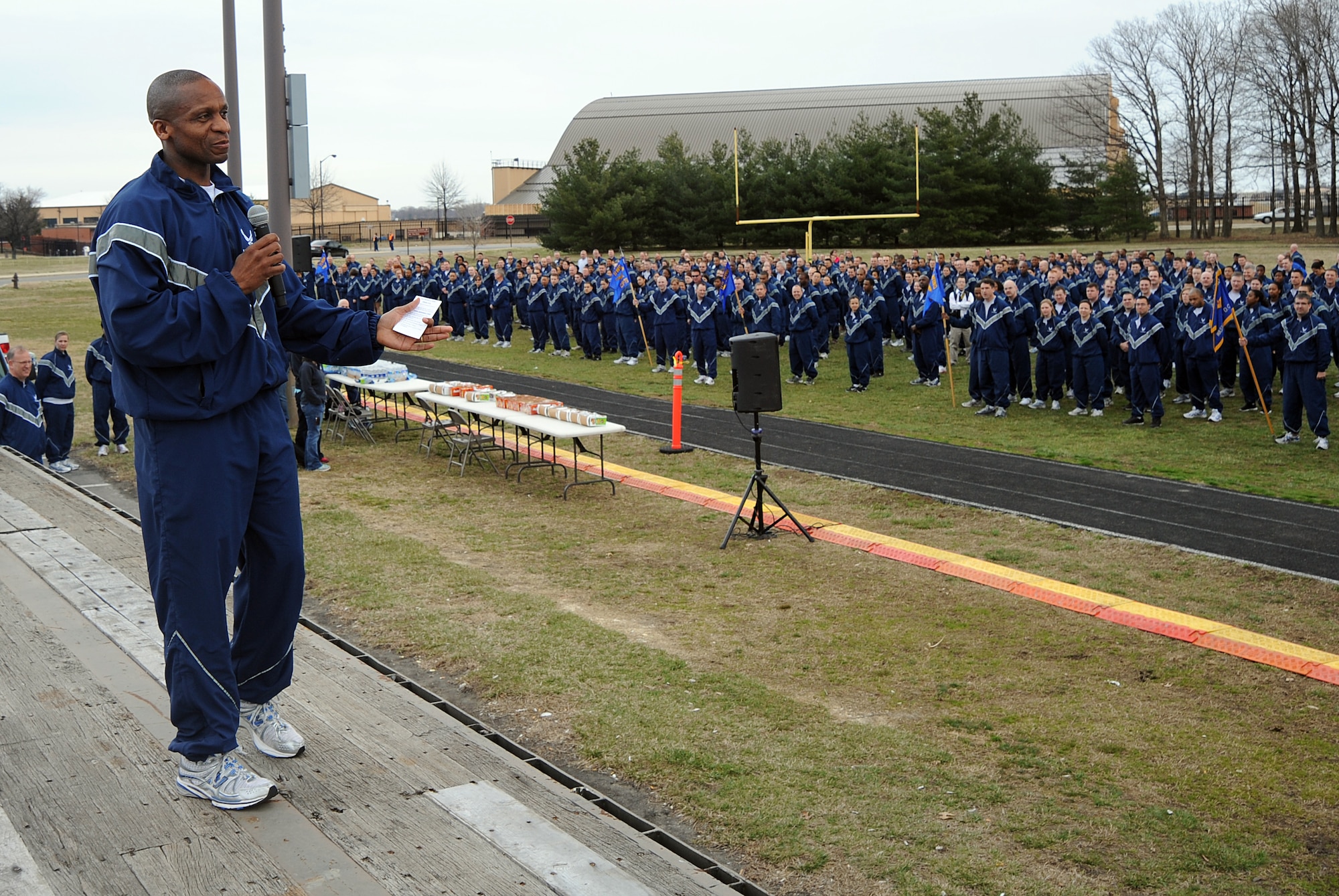 Air Force District of Washington Commander Maj. Gen. Darren McDew addresses U.S. Air Force Honor Guard runners assembled with many other AFDW units for a two-mile fun run March 15 at Joint Base Andrews - NAF Washington, Md. The fun run was dedicated to the Air Force Assistance Fund campaign, which spans March 14 to April 22, 2011 and asks AFDW airmen to raise $74,760. This sum breaks down to a donation of approximately $1.05 a month for every Airman and Civilian in the organization. (USAF Photo by SrA Melissa Brownstein)