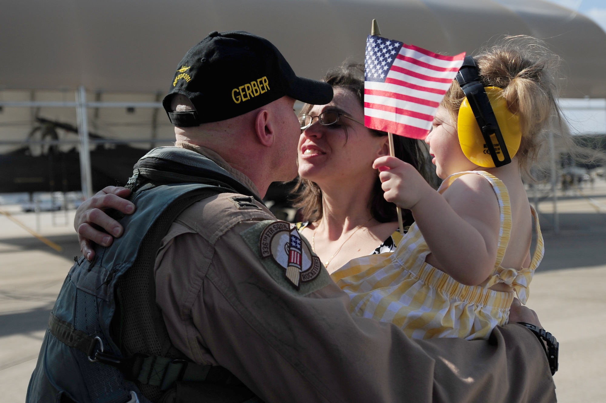 SEYMOUR JOHNSON AIR FORCE BASE, N.C. – Capt. Andrew LaFountain is greeted by his, wife, Rebecca and daughter, Gwendolyn, here March 16, 2011. Captain LaFountain returned from the 336th Fighter Squadron’s first six month deployment in support of Operation Enduring Freedom. Previously, the Fighter Squadrons here deployed for four months. Captain LaFountain is a weapon systems officer, who hails from Denver. (U.S. Air Force photo/Senior Airman Rae Perry) (RELEASED)