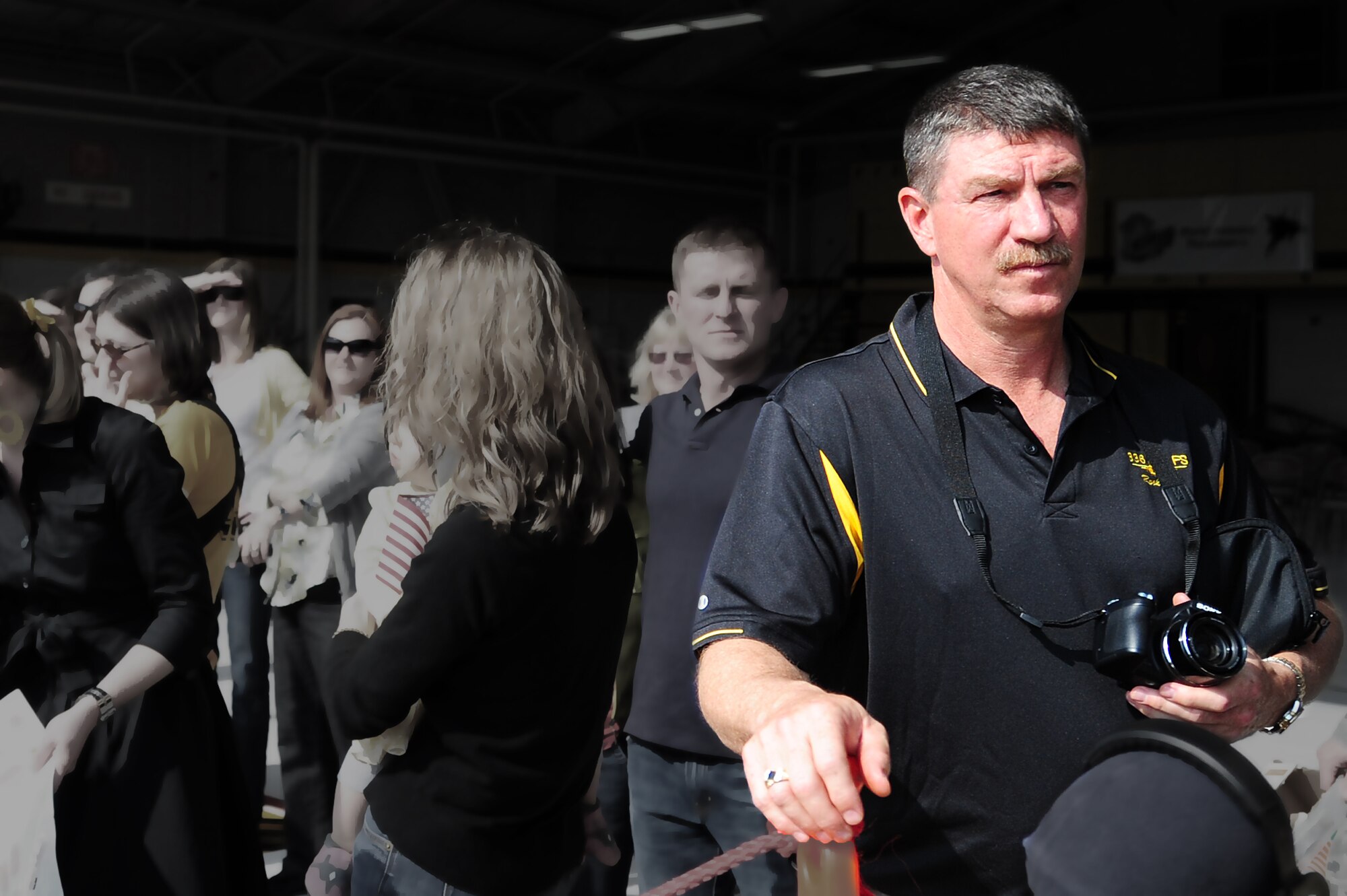 SEYMOUR JOHNSON AIR FORCE BASE, N.C. –Navy Chief Warrant Officer Bob Clift waits for his son’s arrival here March 16, 2011. His son, Capt. Adam Clift, deployed to Afghanistan for six months with the 336th Fighter Squadron as a weapon systems officer. Chief Warrant Officer Clift is stationed at Naval Air Station Oceana, Va. (U.S. Air Force photo illustration/Senior Airman Rae Perry) (RELEASED)