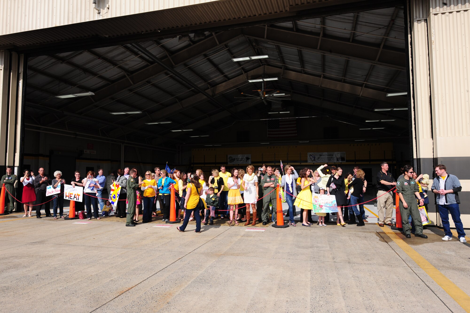 SEYMOUR JOHNSON AIR FORCE BASE, N.C. – A group of friends, family members and fellow Airmen await the return of six F-15E Strike Eagle’s from a deployment to Afghanistan here on March 16, 2011. The 336th Fighter Squadron aircrew members deployed to Bagram Air Field, Afghanistan, to provide close air support for those serving in harm’s way.  (U.S. Air Force photo/Senior Airman Rae Perry) (RELEASED)