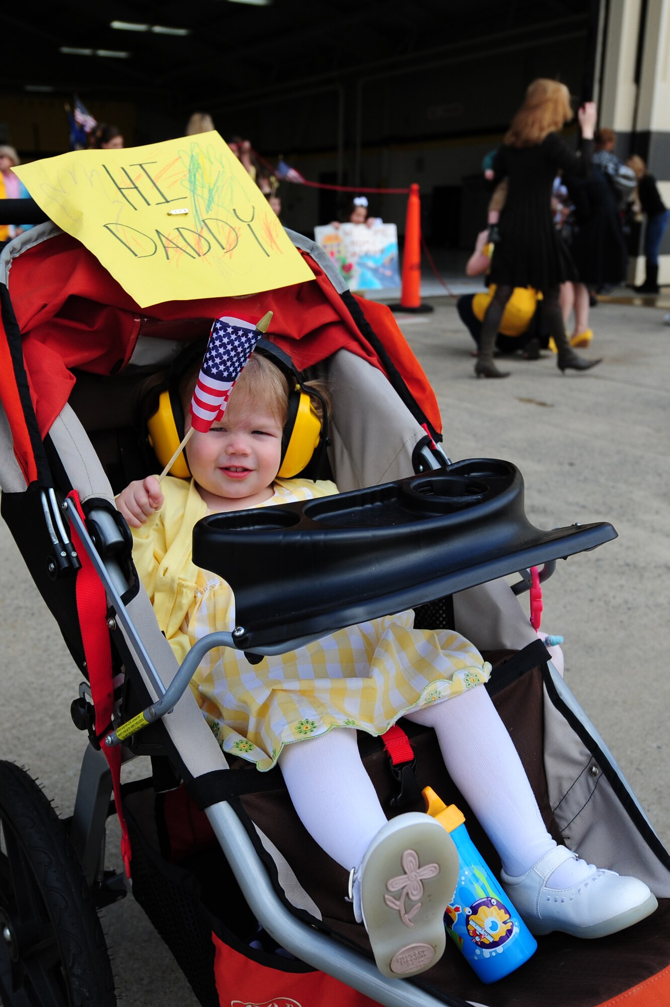 SEYMOUR JOHNSON AIR FORCE BASE, N.C. – Gwendolyn LaFountain, daughter of Capt. Andrew LaFountain, waves the American flag while waiting for her father’s F-15E Strike Eagle to taxi by March 16, 2011. This was the second deployment the LaFountain family has experienced. Captain LaFountain is a 336th Fighter Squadron weapon systems officer, who hails from Denver. (U.S. Air Force photo/Senior Airman Rae Perry) (RELEASED)